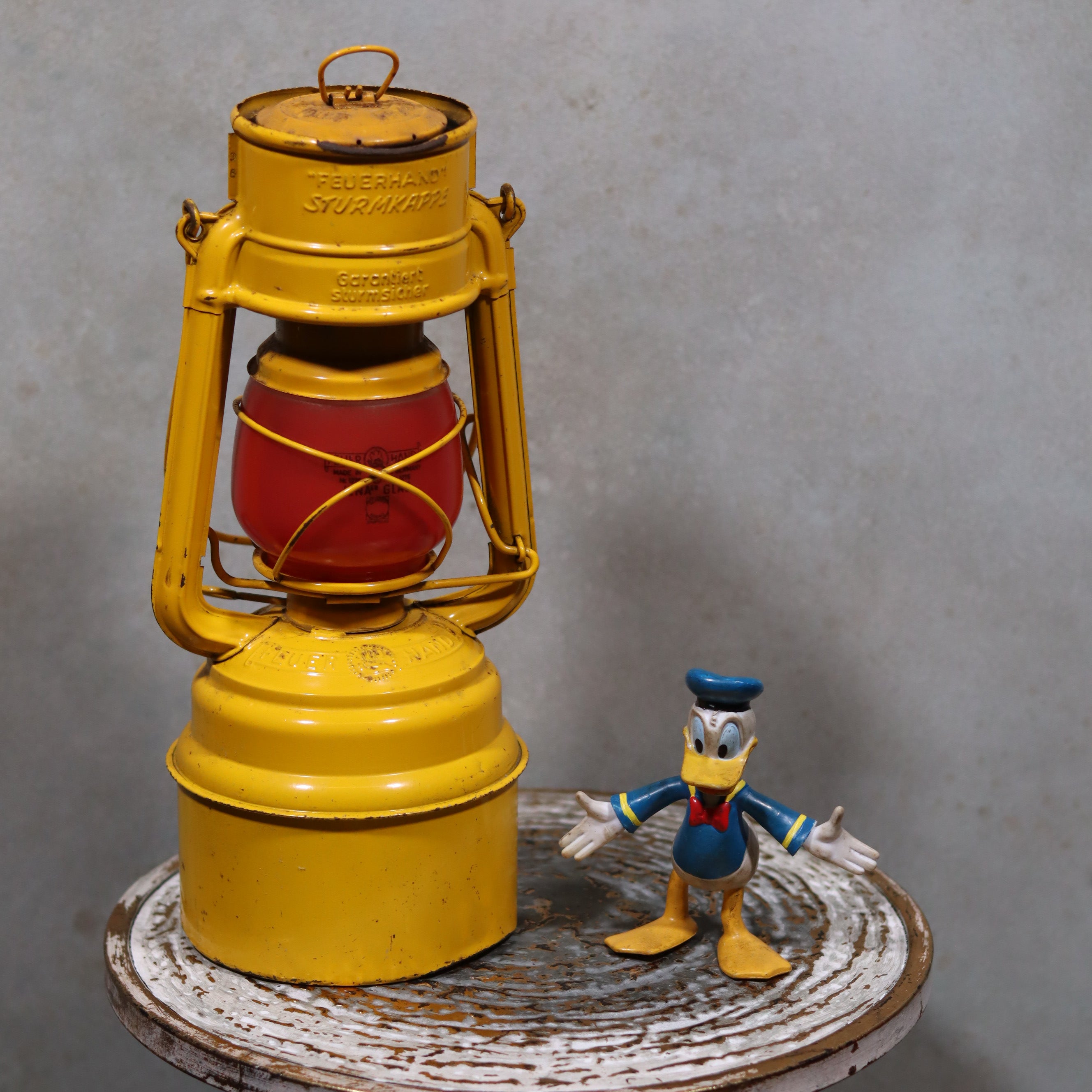 Vintage Feuerhand Hurricane Lantern – Baby Special 276 STK/70 oil lamp showcasing German craftsmanship with bright yellow finish.