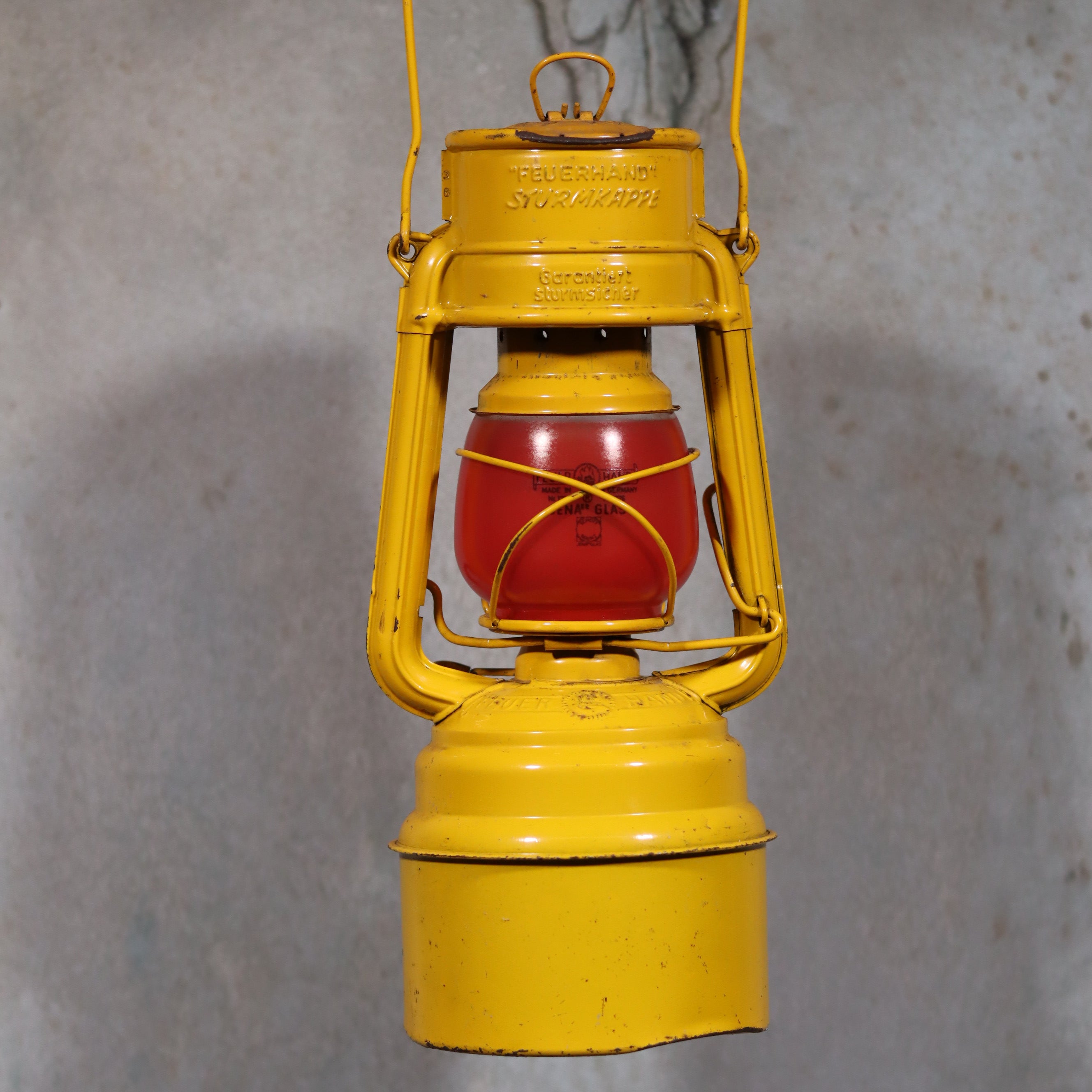 Vintage Feuerhand Hurricane Lantern – Baby Special 276 STK/70 oil lamp in yellow with red globe and German craftsmanship details.