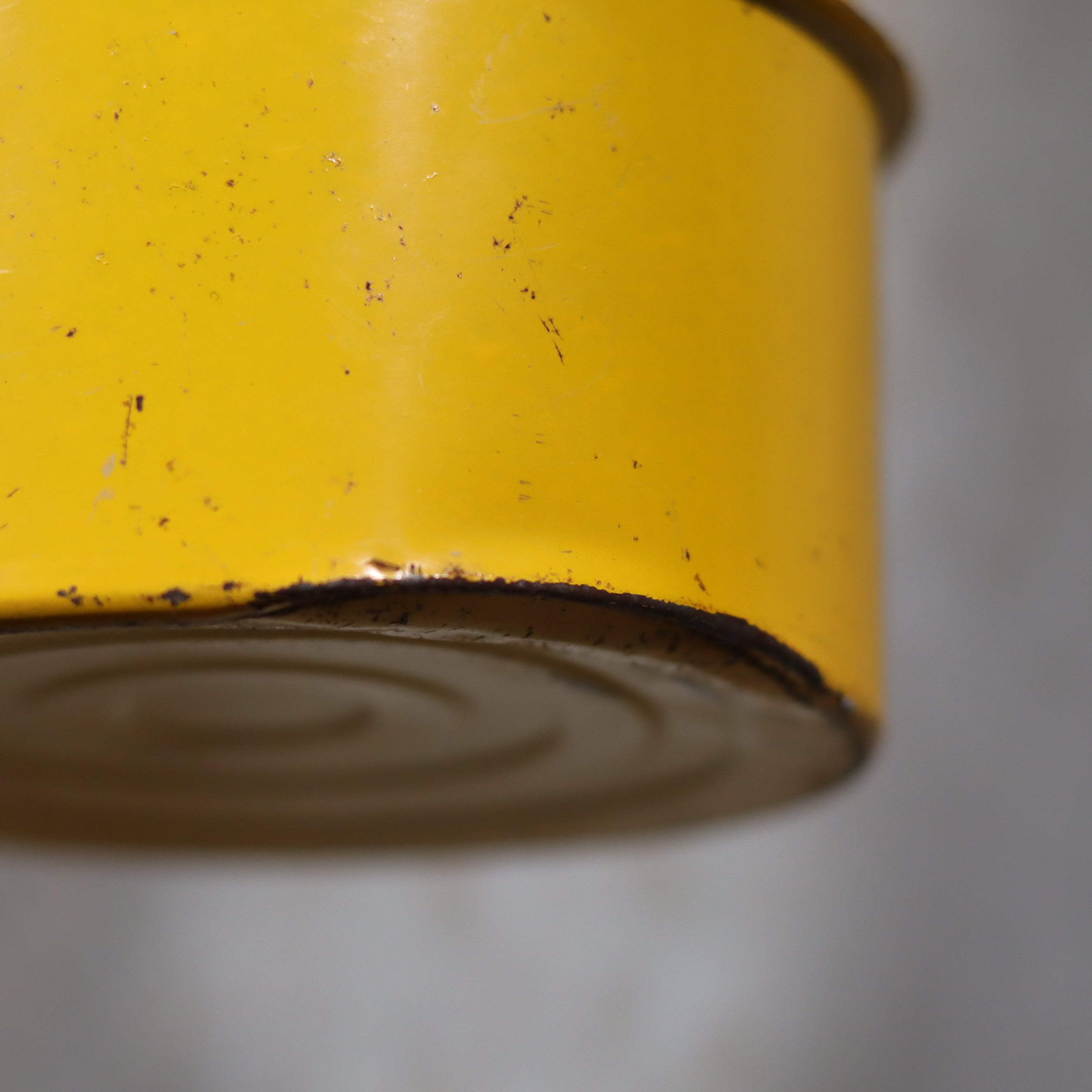 Vintage Feuerhand Hurricane Lantern – Baby Special 276 STK/70 showing close-up detail of worn yellow metal base of oil lamp