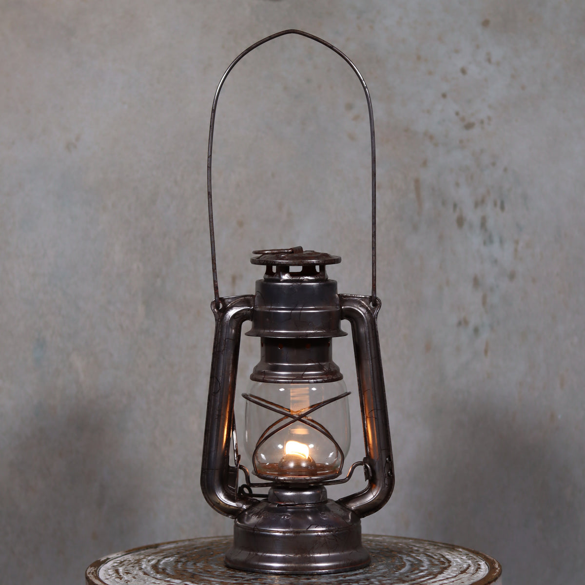 Vintage Czech Storm Lantern – Meva 863 – Made in Czechoslovakia – 1971 – Original Glass oil lamp lit on metal surface