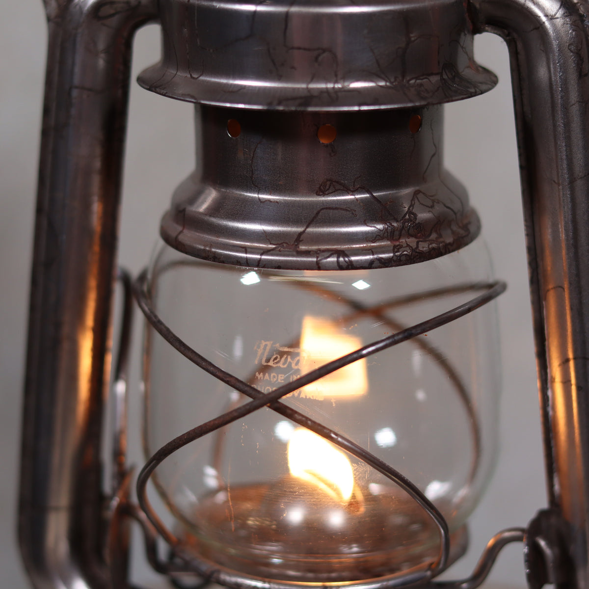 Vintage Czech Storm Lantern – Meva 863 – Made in Czechoslovakia – 1971 – Original Glass oil lamp close-up showing flame and metal details