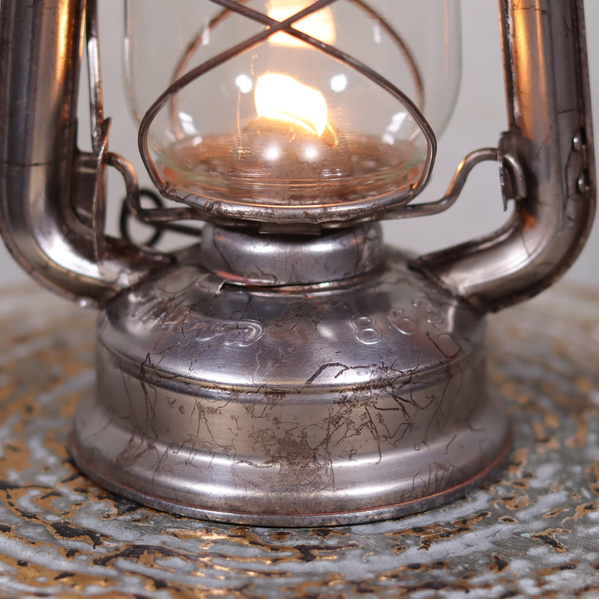 Vintage Czech Storm Lantern – Meva 863 – Made in Czechoslovakia – 1971 – Original Glass oil lamp with lit flame close-up.