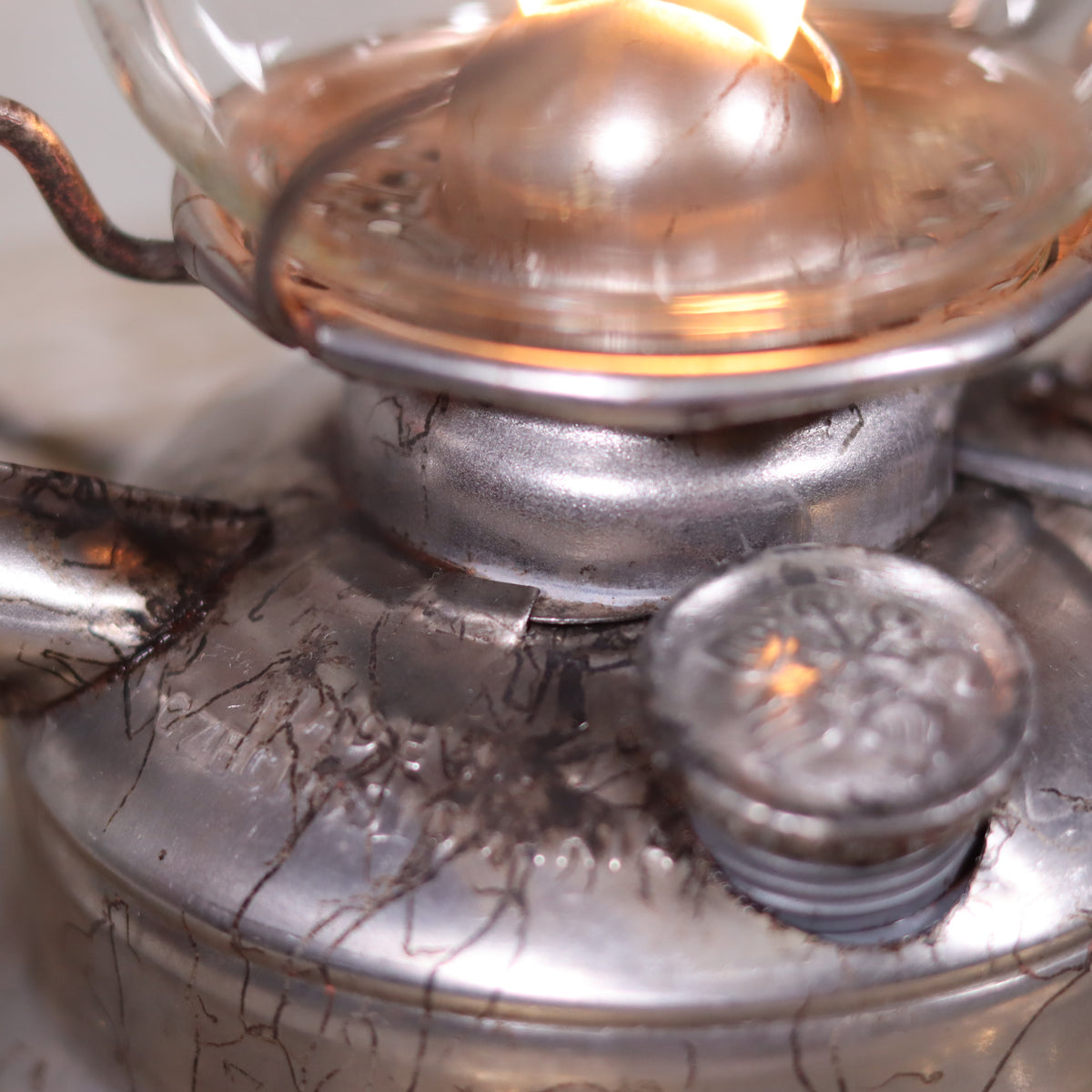 Vintage Czech Storm Lantern – Meva 863 – Made in Czechoslovakia – 1971 – Original Glass oil lamp close-up detail of metal and flame