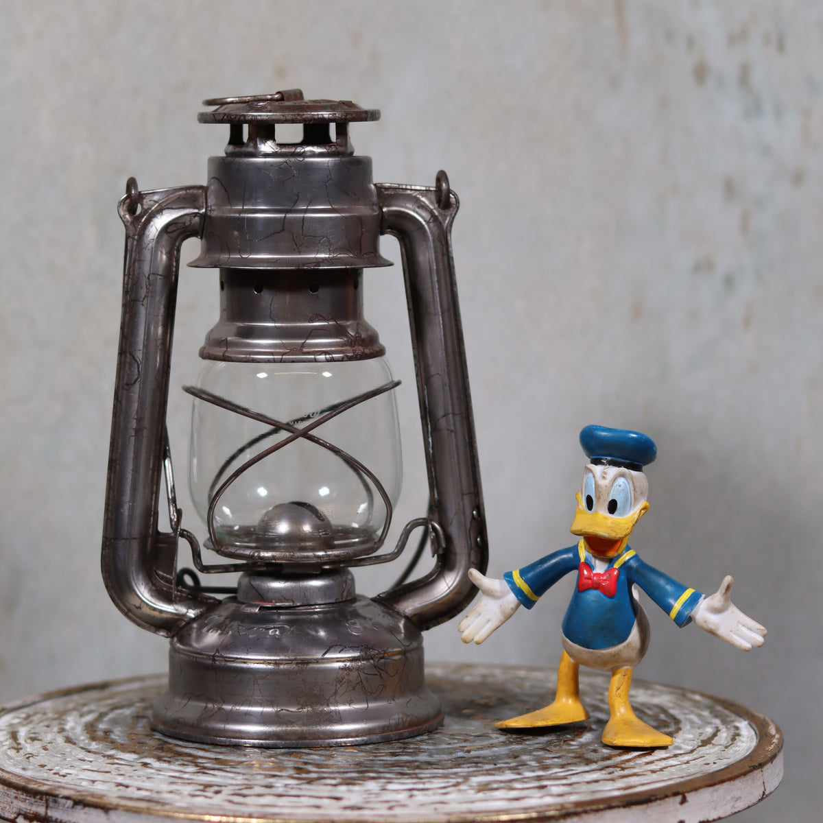 Vintage Czech Storm Lantern – Meva 863 – Made in Czechoslovakia – 1971 – Original Glass oil lamp displayed on rustic surface