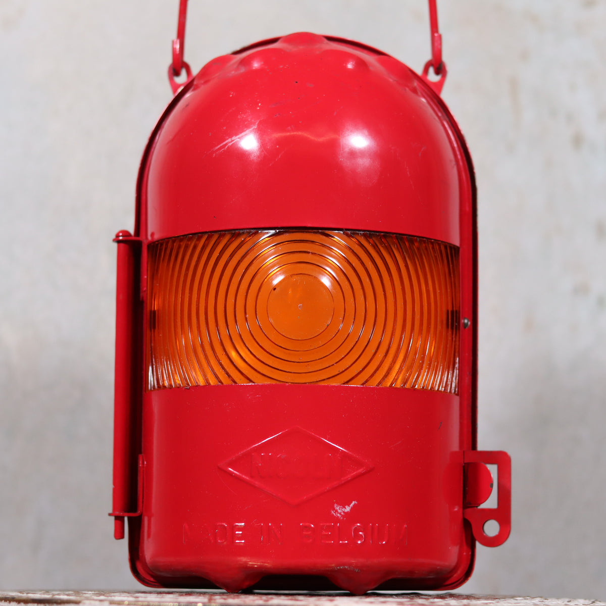 NOS Vintage Nicoln Flashing Oil Lamp – Road Worker Lantern with Original Manual in red with amber lens close-up view