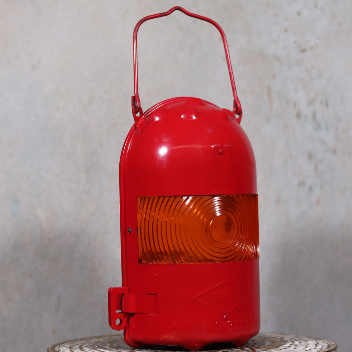 NOS Vintage Nicoln Flashing Oil Lamp – Road Worker Lantern with Original Manual in red with orange lens displayed on a surface