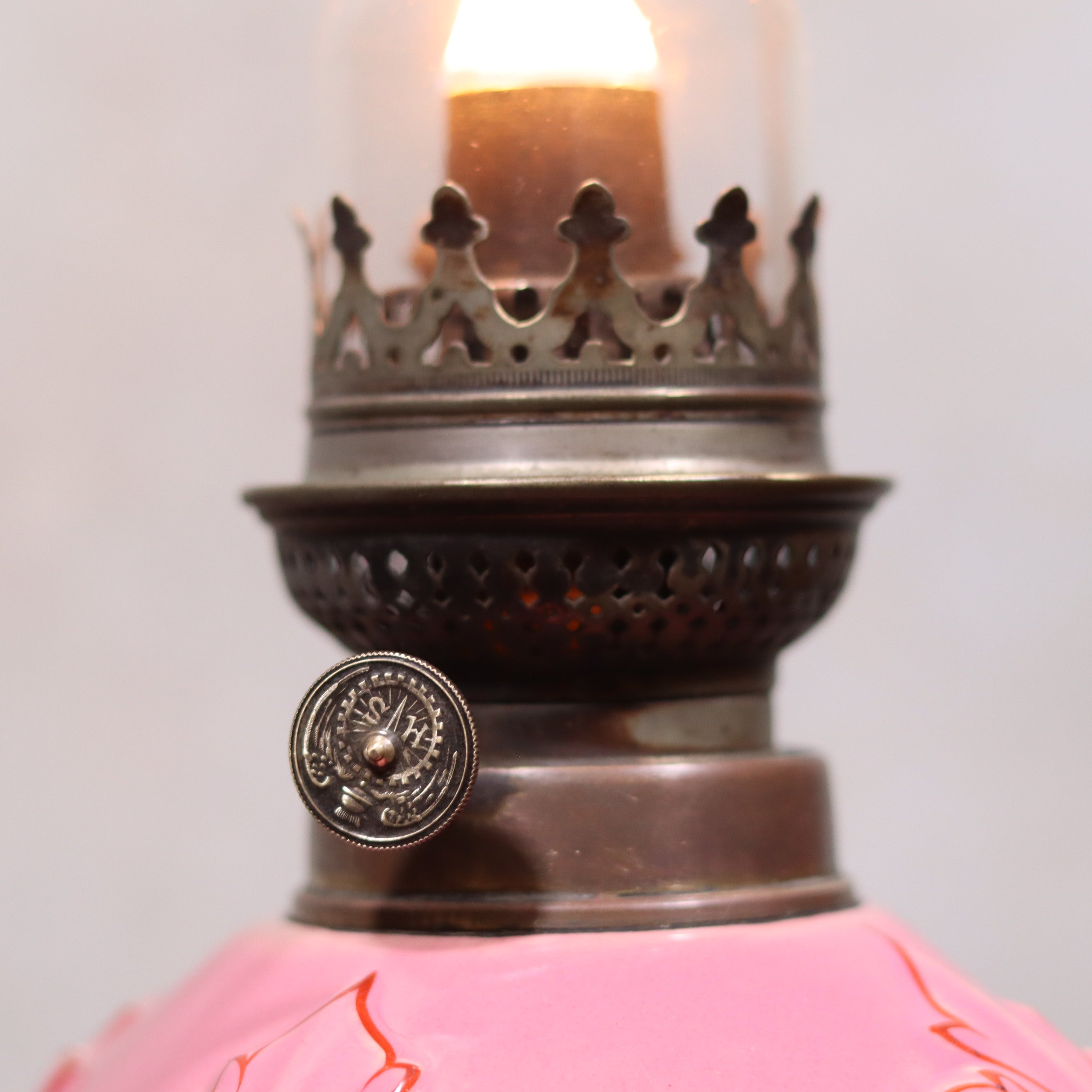 Elegant Vintage Porcelain Oil Lamp – Pink with Grape Motif – Hugo Schneider Burner – 1930s close-up of burner detail and lit flame