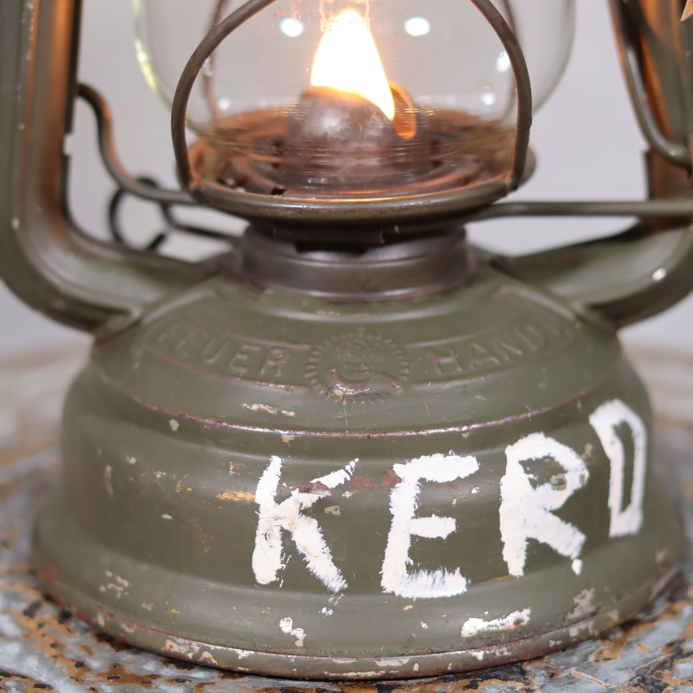 Vintage Feuerhand Hurricane Lantern – Baby Special 276 (1980s, KL-88 Military Marking) oil lamp lit with metal frame