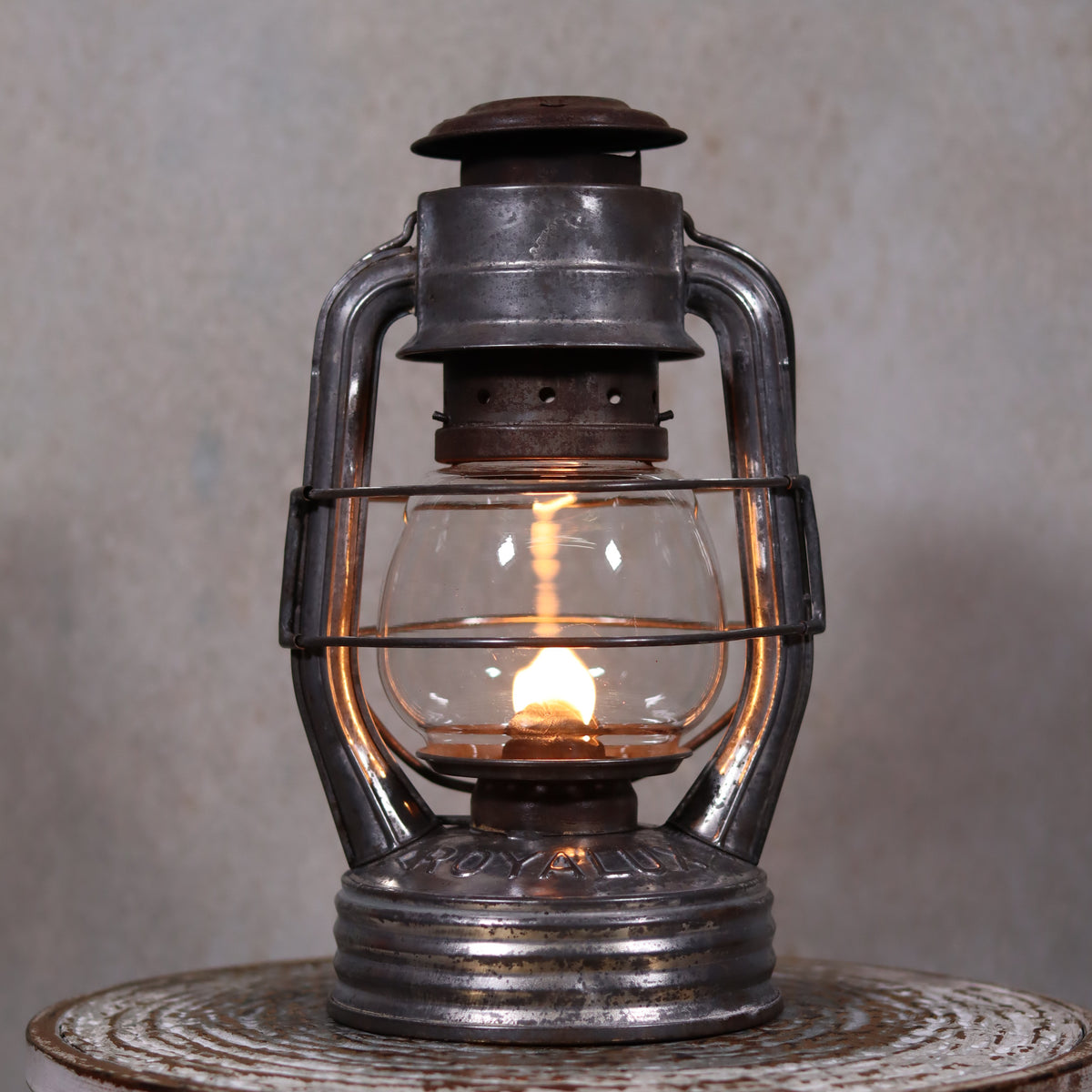 Vintage French Royalux Hurricane Lantern – Rare Glass Lift & Cage (27 cm) oil lamp with lit flame and metal frame