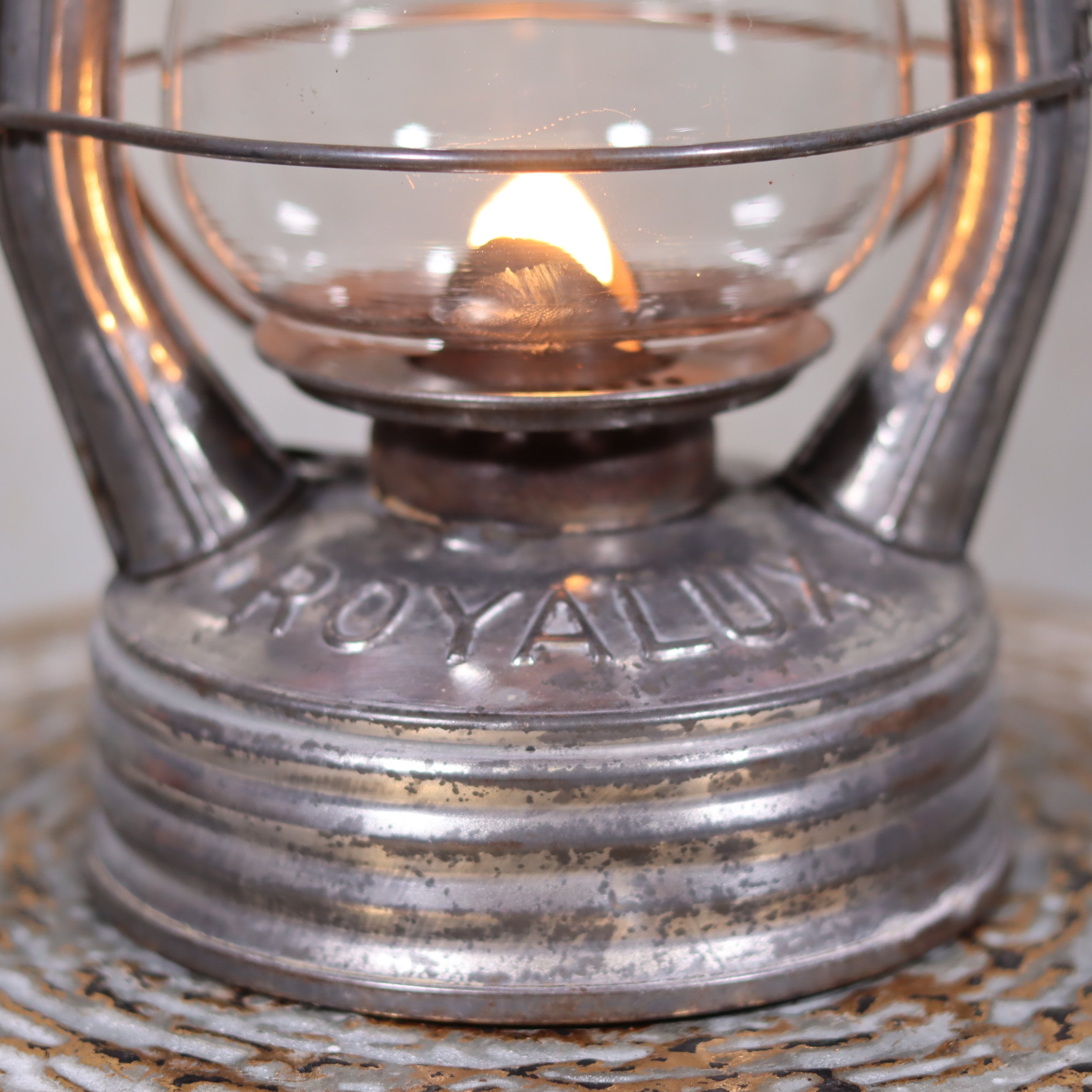 Vintage French Royalux Hurricane Lantern – Rare Glass Lift & Cage (27 cm) with lit oil lamp and detailed metal base design