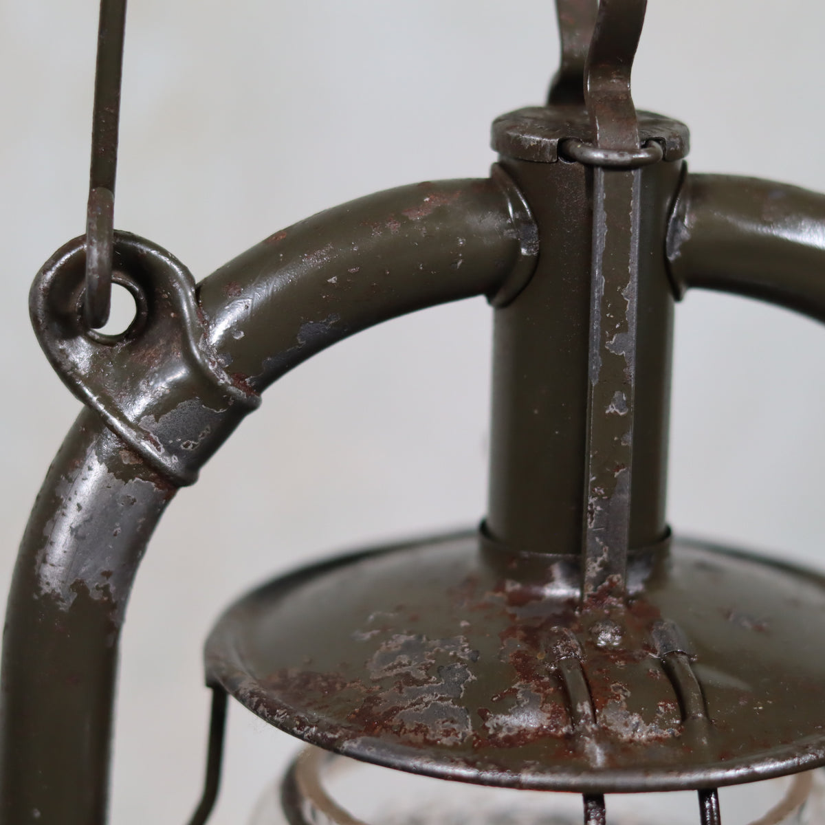 Vintage Feuerhand 323 Storm Lantern – Late 1930s, Original Paint & Embossed Glass with weathered metal oil lamp parts close-up