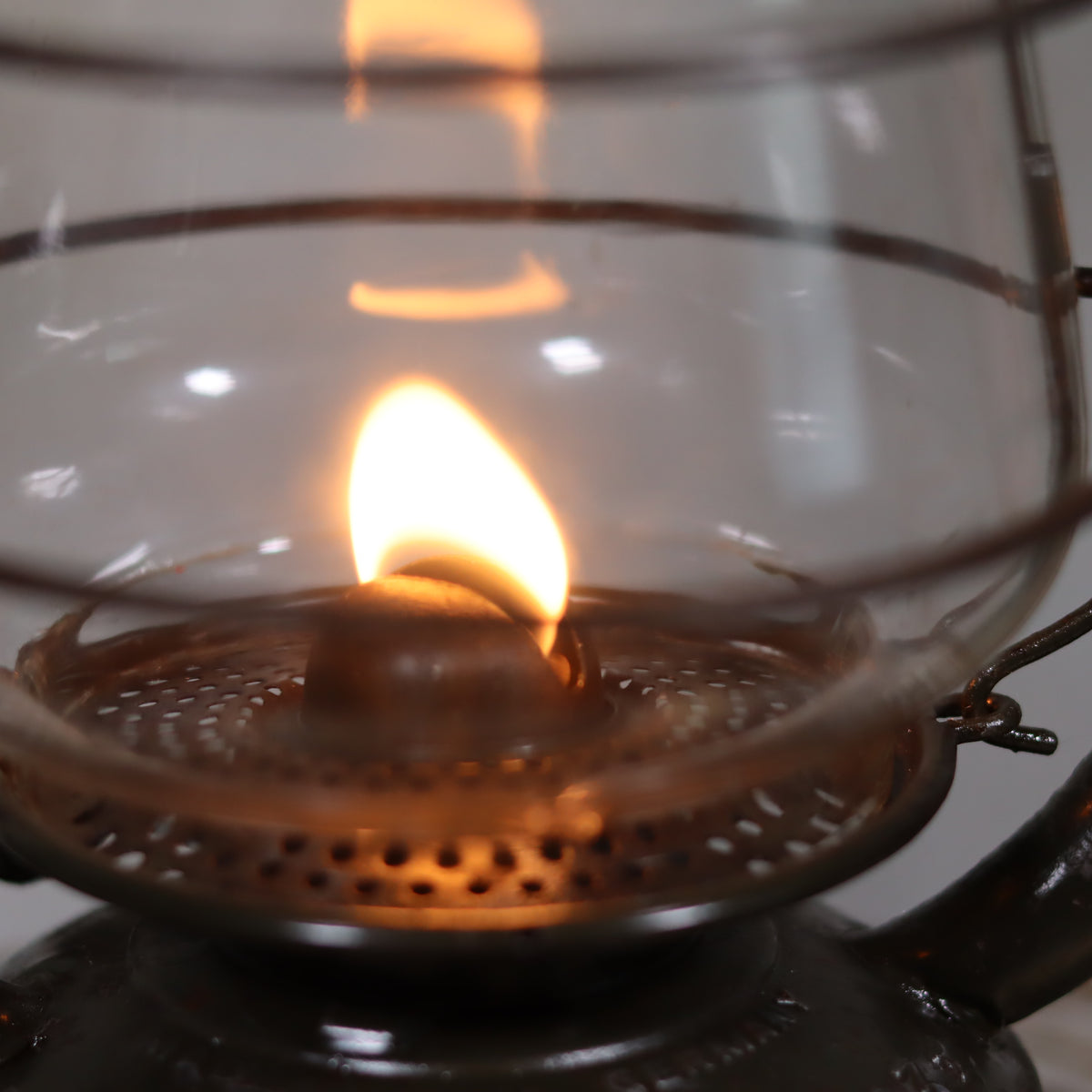 Vintage Feuerhand 323 Storm Lantern – Late 1930s, Original Paint & Embossed Glass showing the oil flame inside the lamp