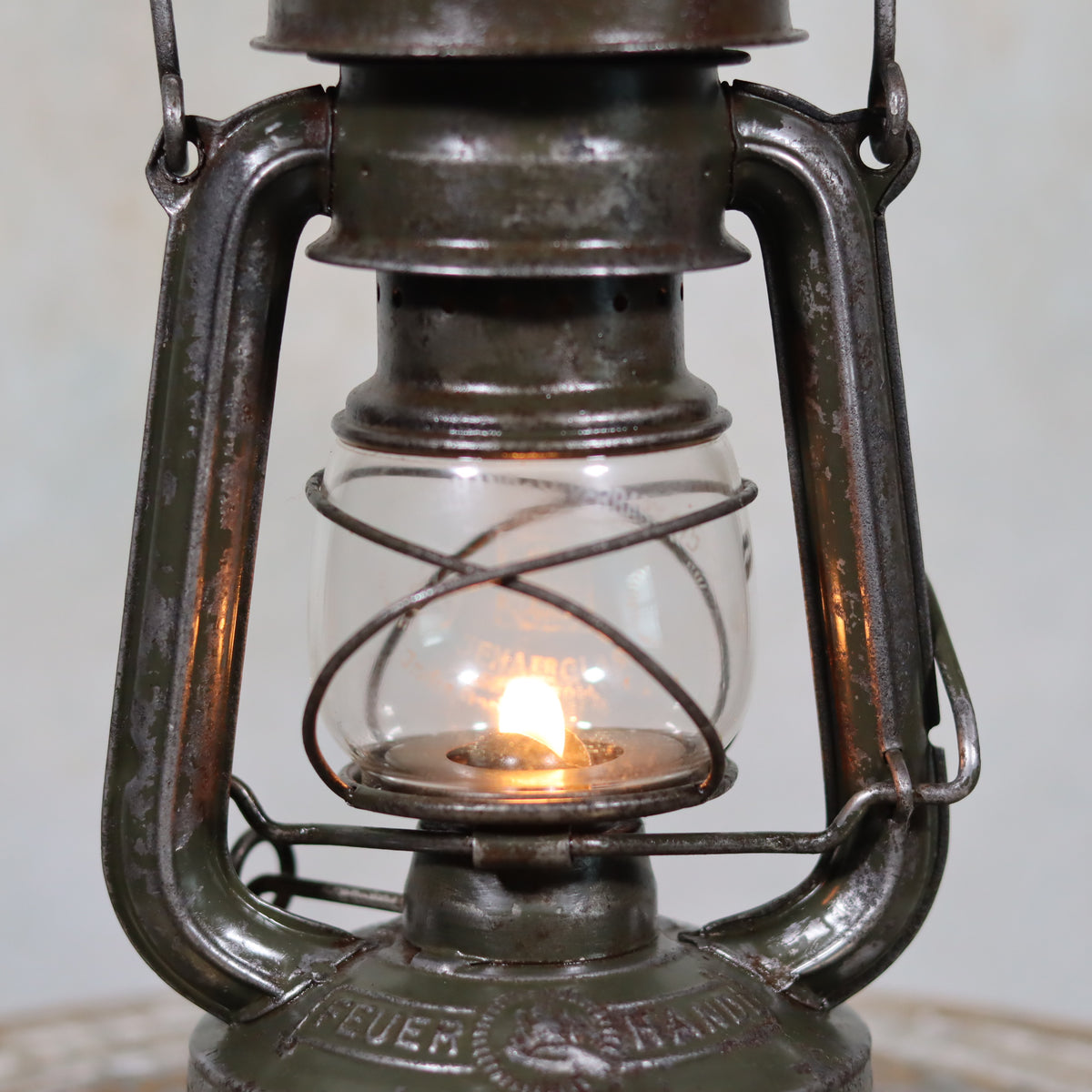 Rare Feuerhand 176 Storm Lantern – “Pilzkopf” Design with Original Glass (1940s) showing lit oil lamp detail