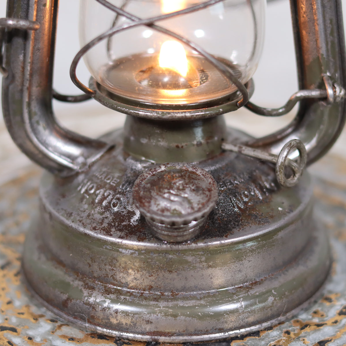 Rare Feuerhand 176 Storm Lantern – “Pilzkopf” Design with Original Glass (1940s) oil lamp close-up showing flame and metal base