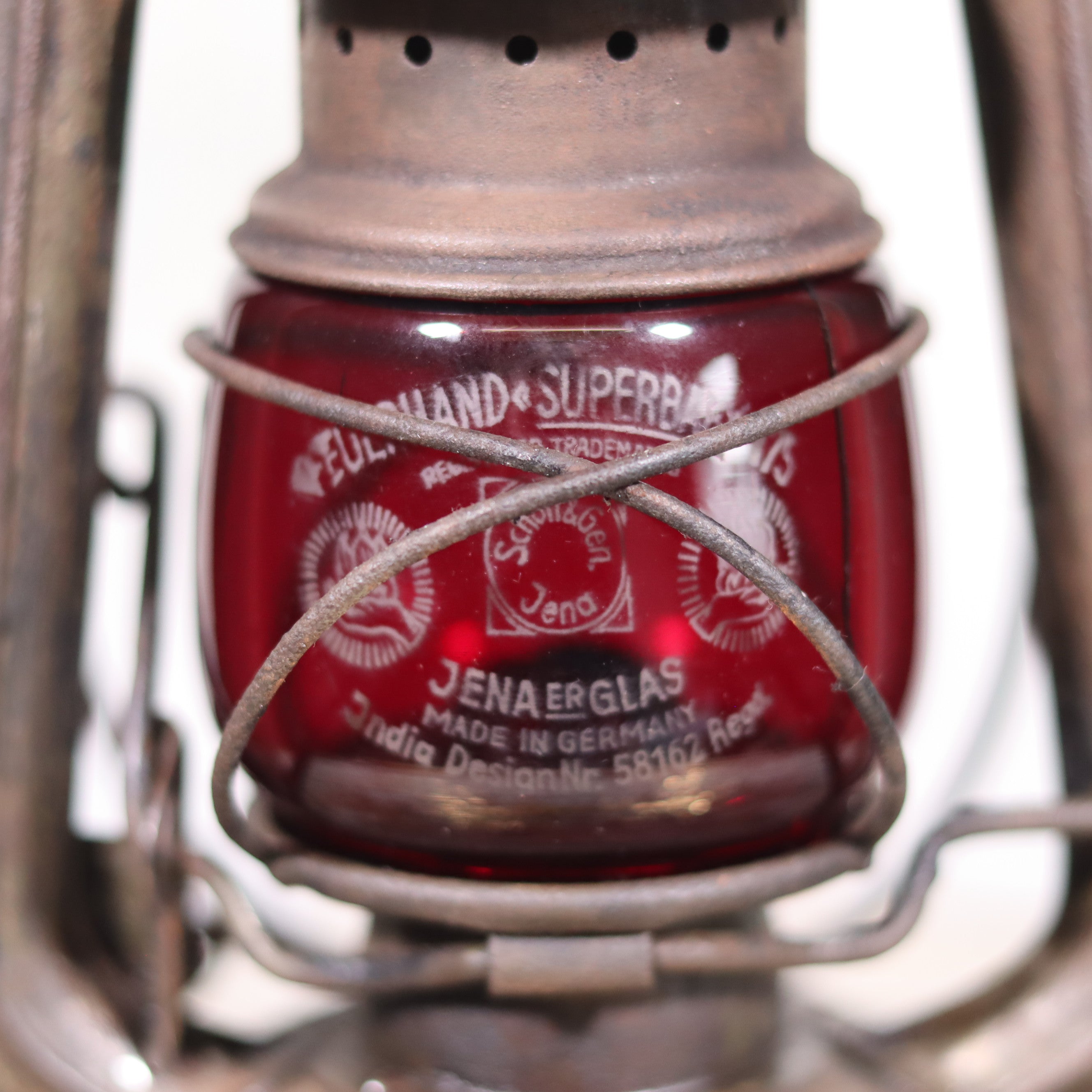 Vintage Pre-War Storm Lantern – Feuerhand 175 (1930s) with Red Glass oil lamp showcasing authentic German craftsmanship detail.