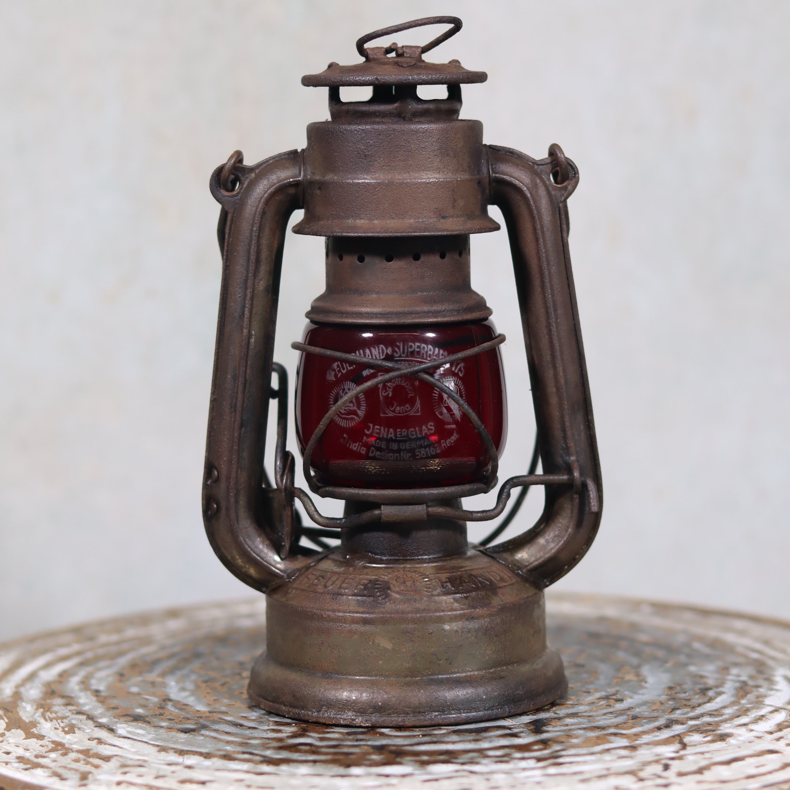 Vintage Pre-War Storm Lantern – Feuerhand 175 (1930s) with Red Glass classic oil lamp with metal frame and red globe.