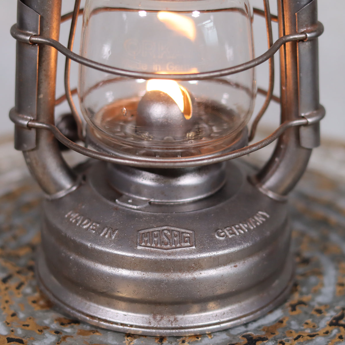 Close-up of the oil lamp flame on the Extremely Rare Pre-War Storm Lantern – Hasag Orkan No. 333 (1937–1939) showing brand details