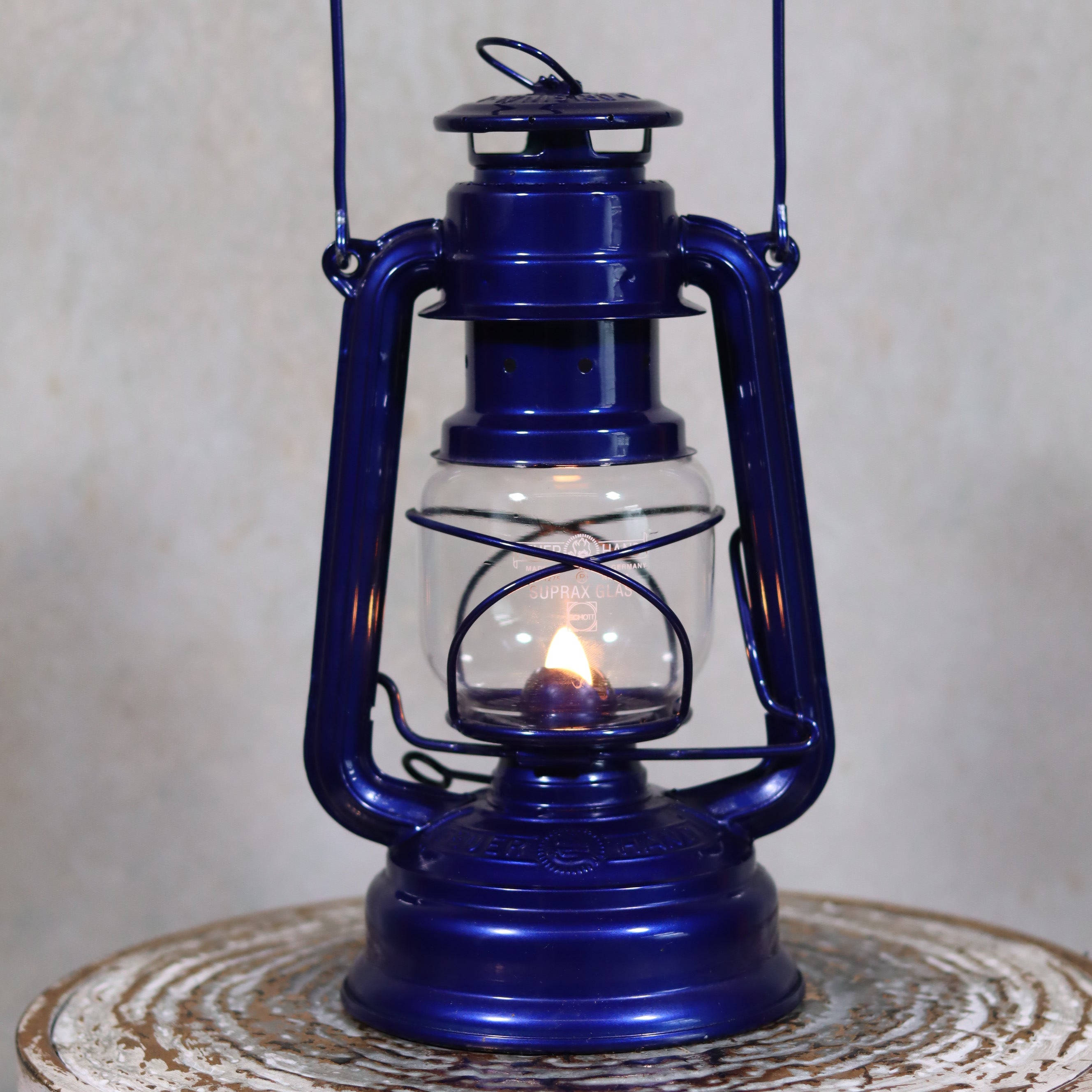 Rare Feuerhand 276 “Night Beach” – Limited Edition Airbrush Model (Near Mint) blue oil lamp with lit flame on rustic surface