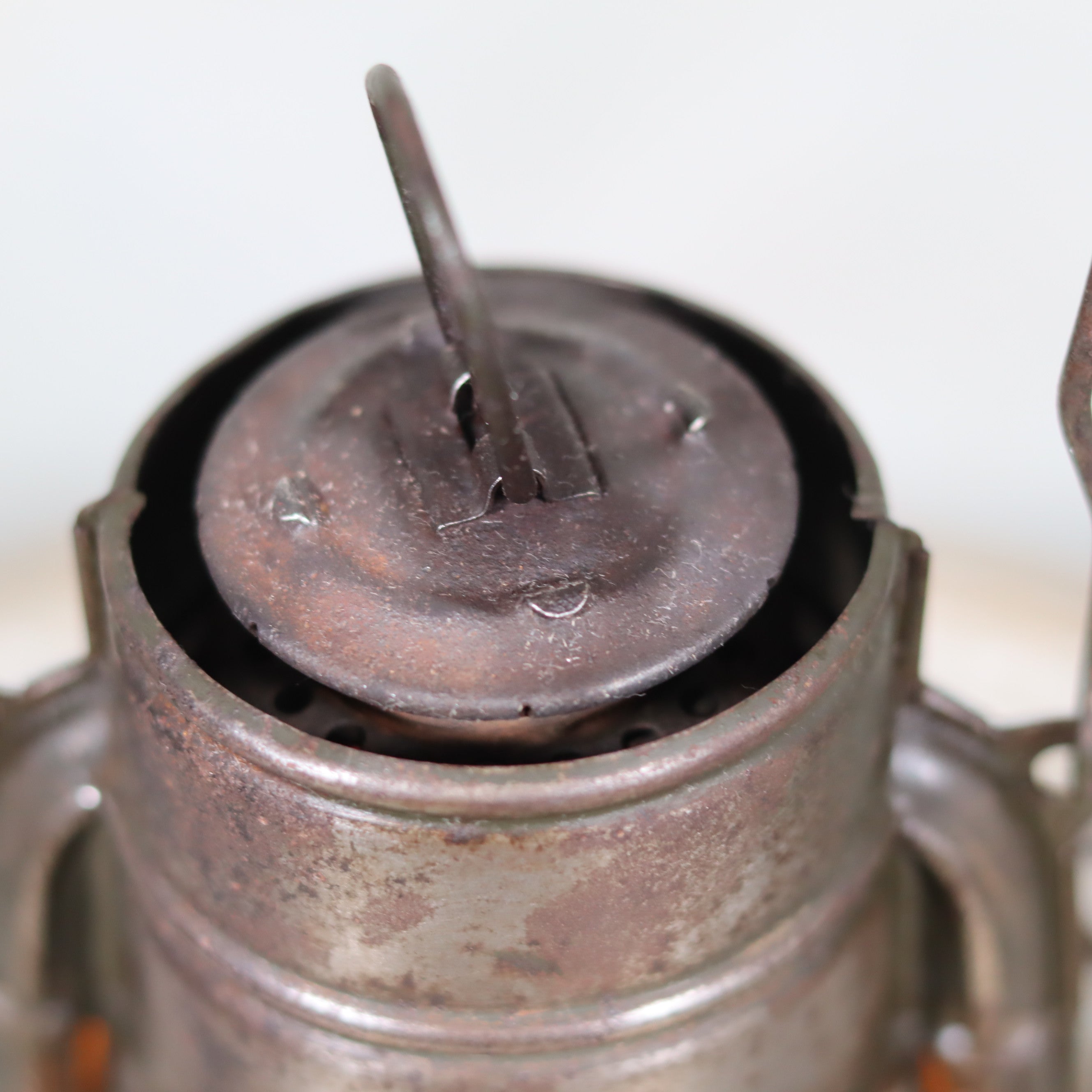 Close-up of a rusted oil lamp part on the Beautiful and Functional Feuerhand “Atom 75 STK” Storm Lantern – Pre-War, Late 1930s to Early 1940s