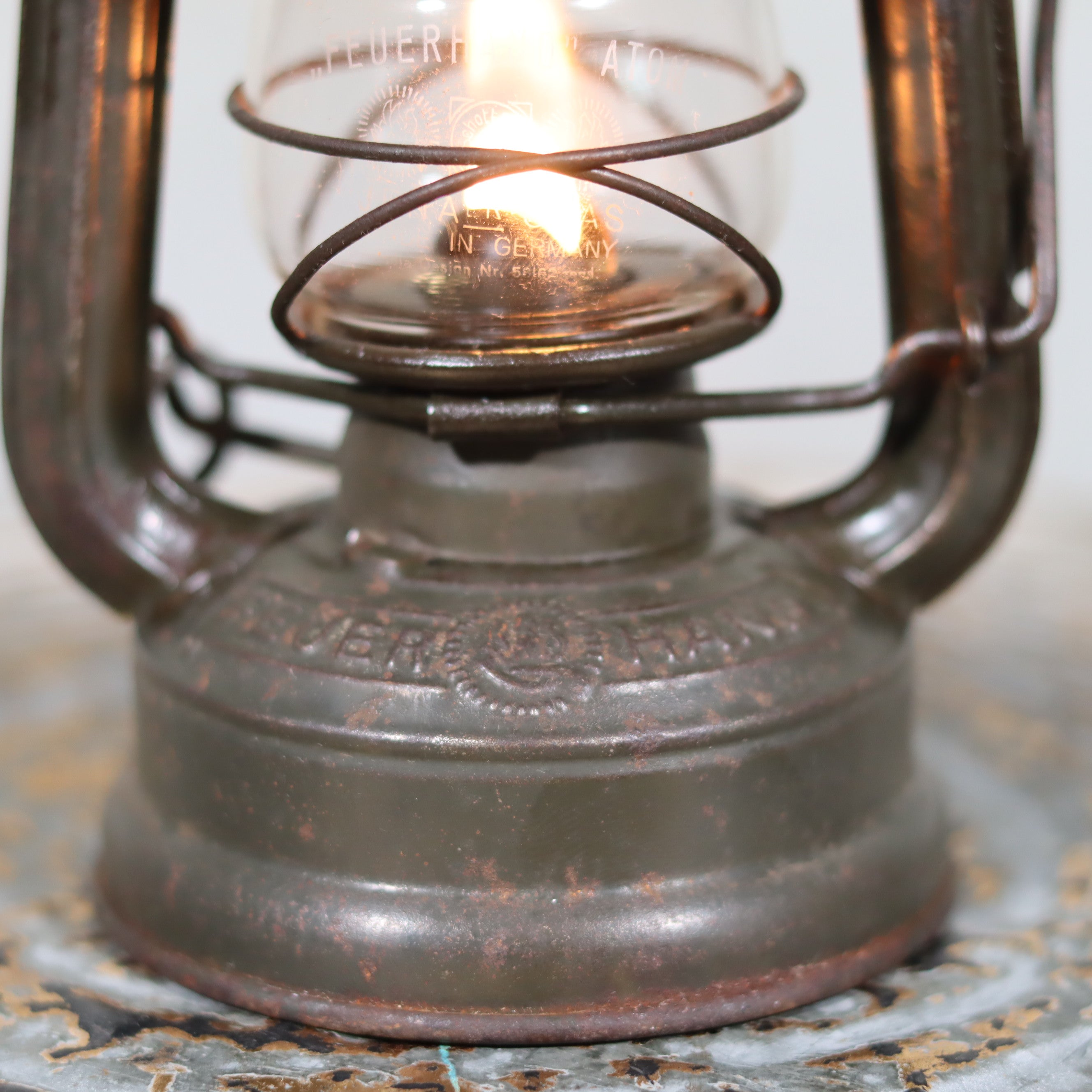 Beautiful and Functional Feuerhand “Atom 75 STK” Storm Lantern – Pre-War, Late 1930s to Early 1940s close-up of oil lamp base and glass chimney.
