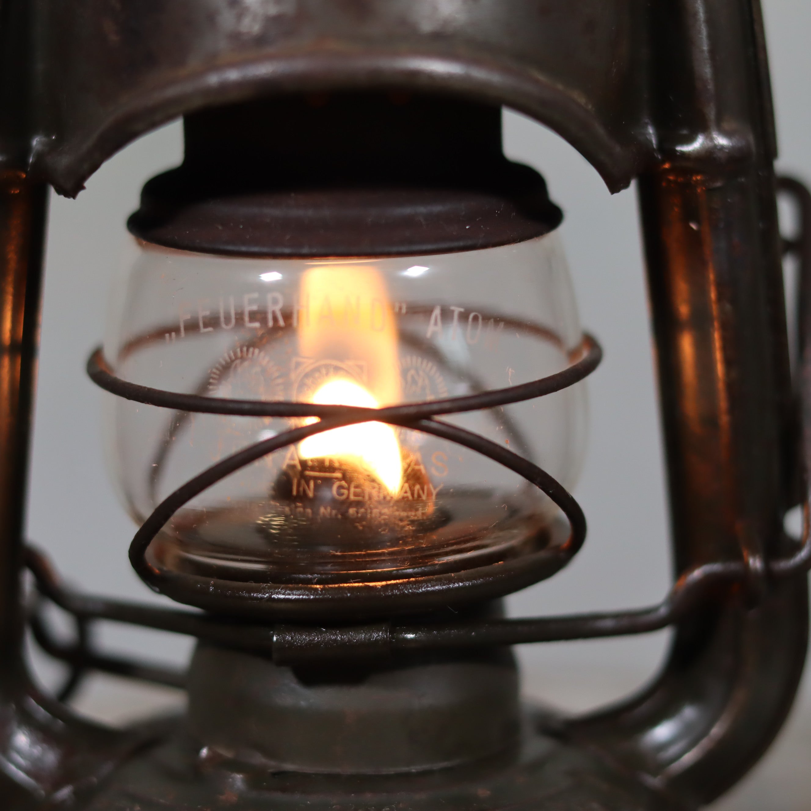 Beautiful and Functional Feuerhand “Atom 75 STK” Storm Lantern glowing with vintage charm from the late 1930s to early 1940s