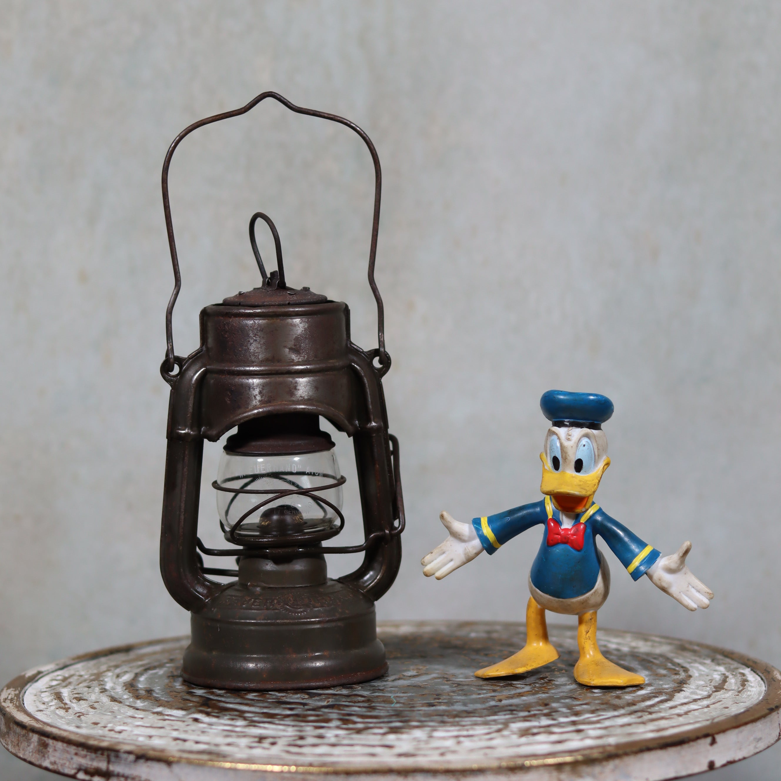 Beautiful and Functional Feuerhand “Atom 75 STK” Storm Lantern – Pre-War, Late 1930s to Early 1940s vintage oil lamp displayed with a toy figure