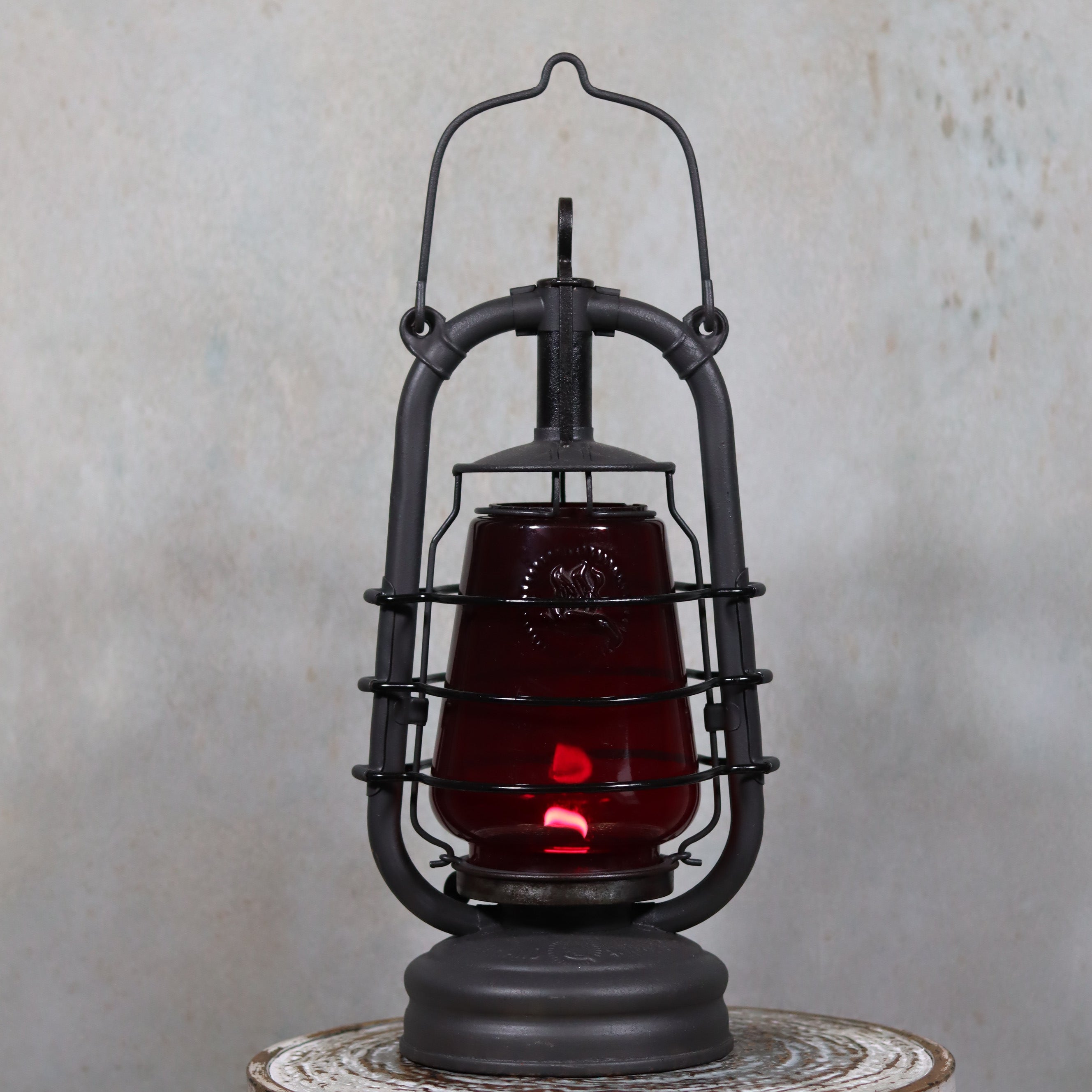 Beautiful Feuerhand 201 Storm Lantern – Germany, 1930s – With Rare Red Logo Glass oil lamp with protective metal frame and glowing wick