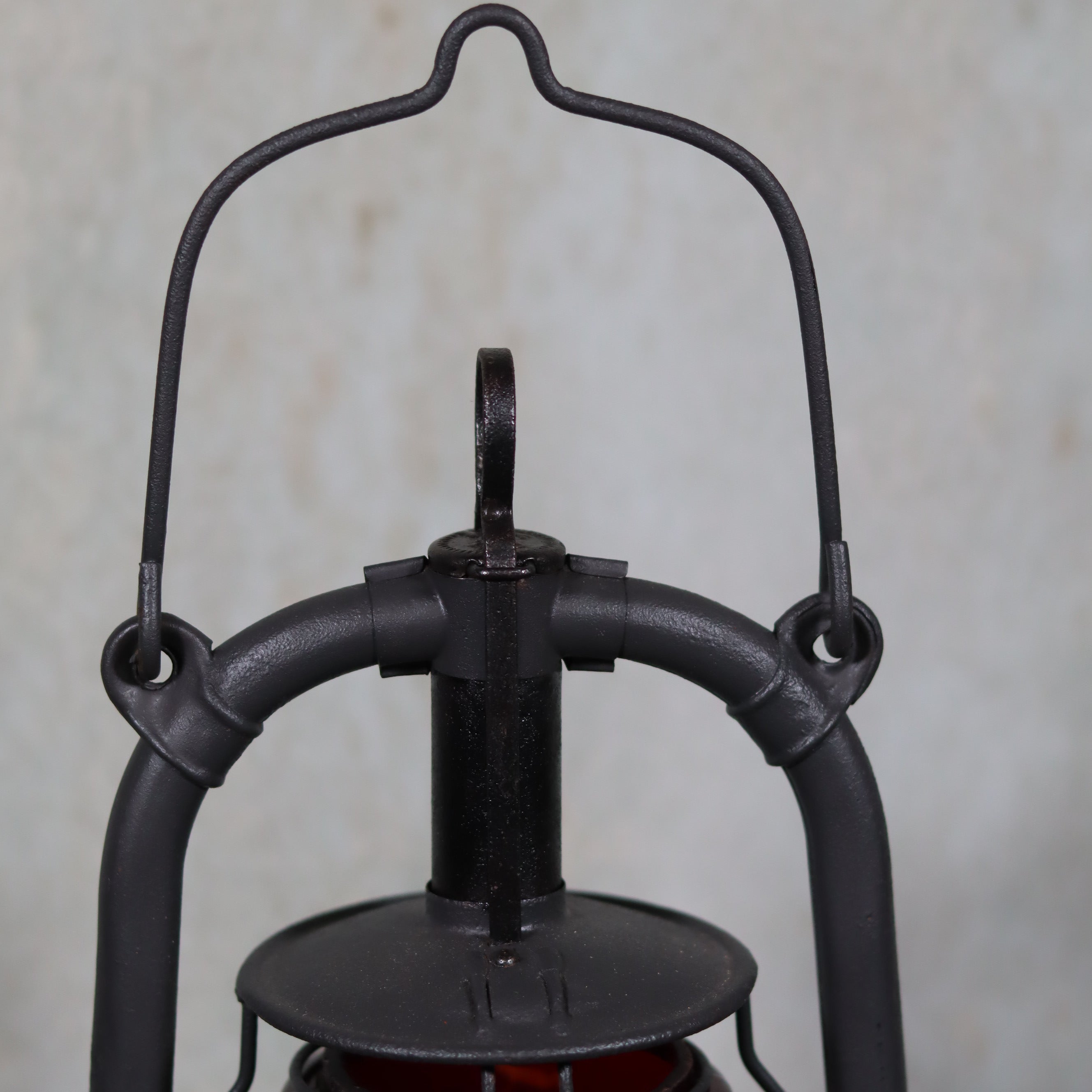 Beautiful Feuerhand 201 Storm Lantern – Germany, 1930s – With Rare Red Logo Glass oil lamp close-up of top handle and frame