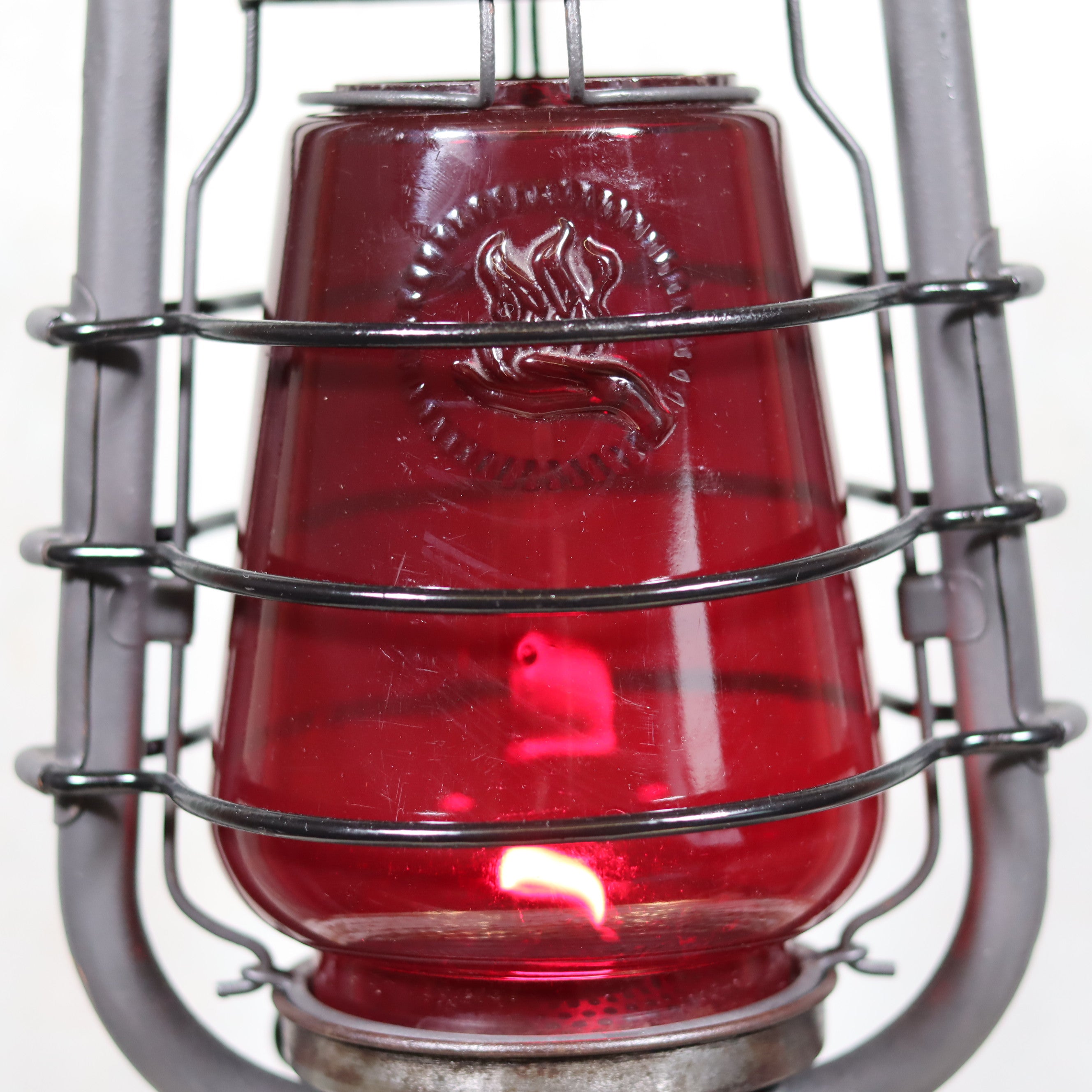 Beautiful Feuerhand 201 Storm Lantern – Germany, 1930s – Rare red logo glass highlights classic oil lamp design by Feuerhand.