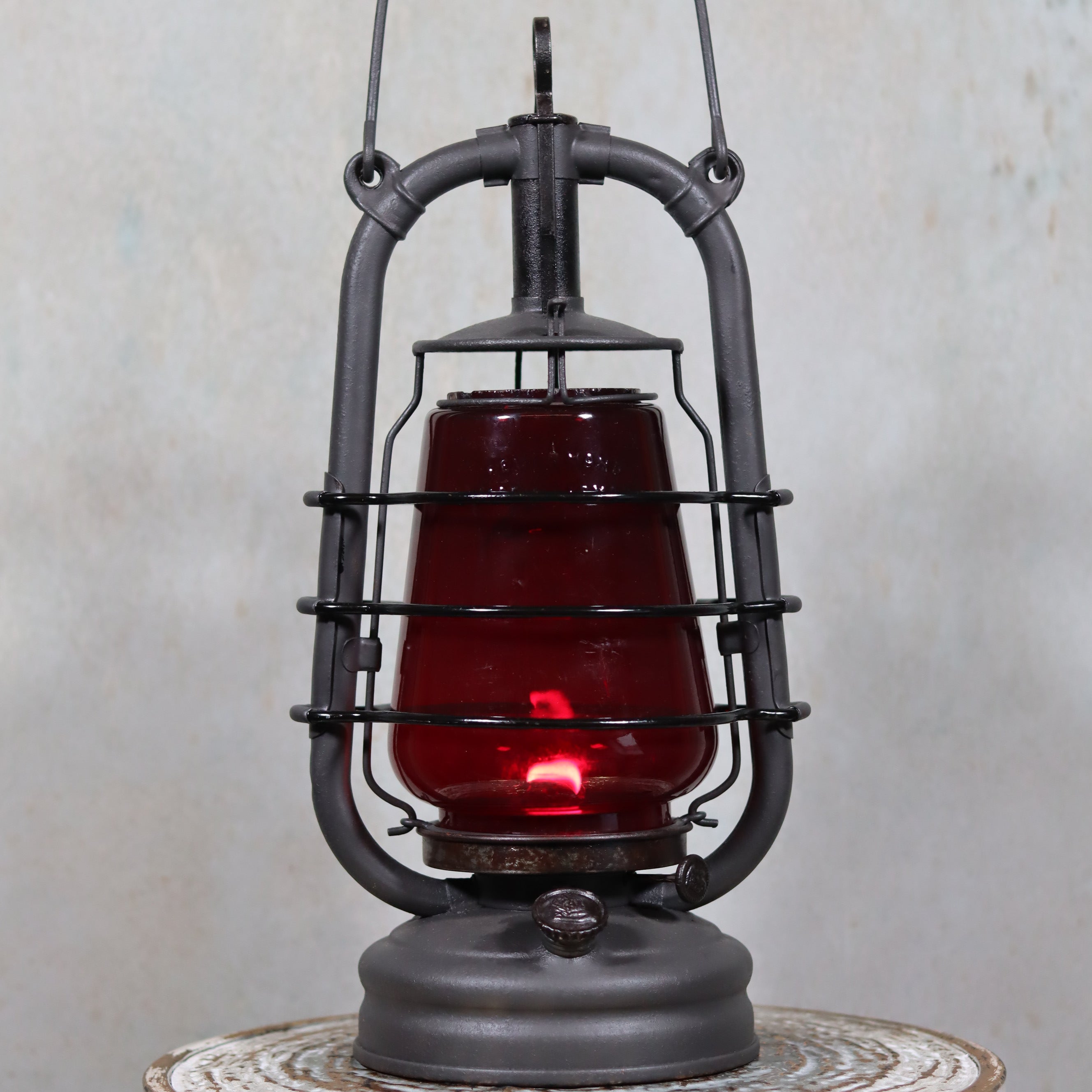 Beautiful Feuerhand 201 Storm Lantern – Germany, 1930s – With Rare Red Logo Glass oil lamp with protective metal frame and handle