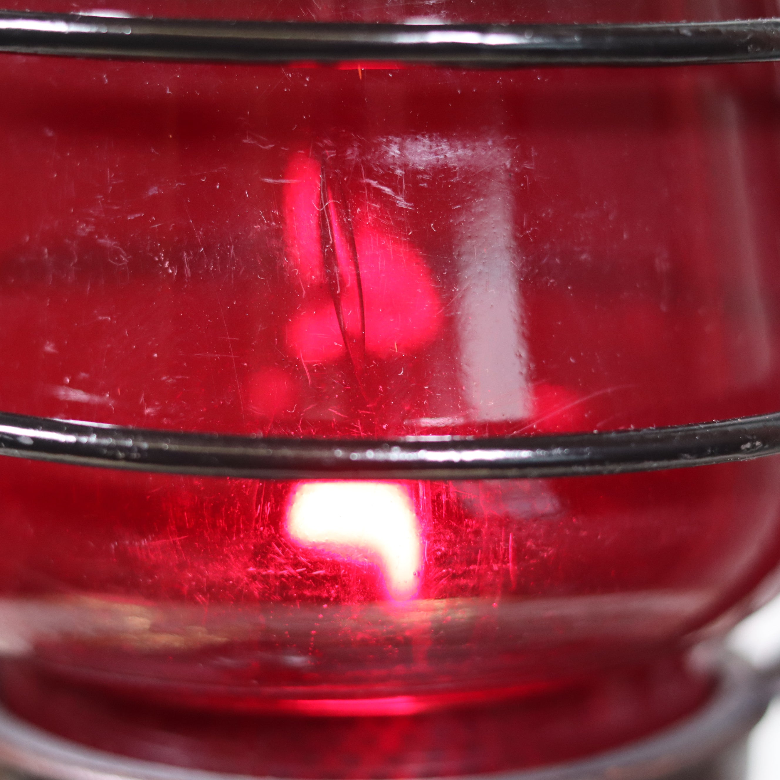 Beautiful Feuerhand 201 Storm Lantern – Germany, 1930s – With Rare Red Logo Glass oil lamp close-up showing flame and glass details