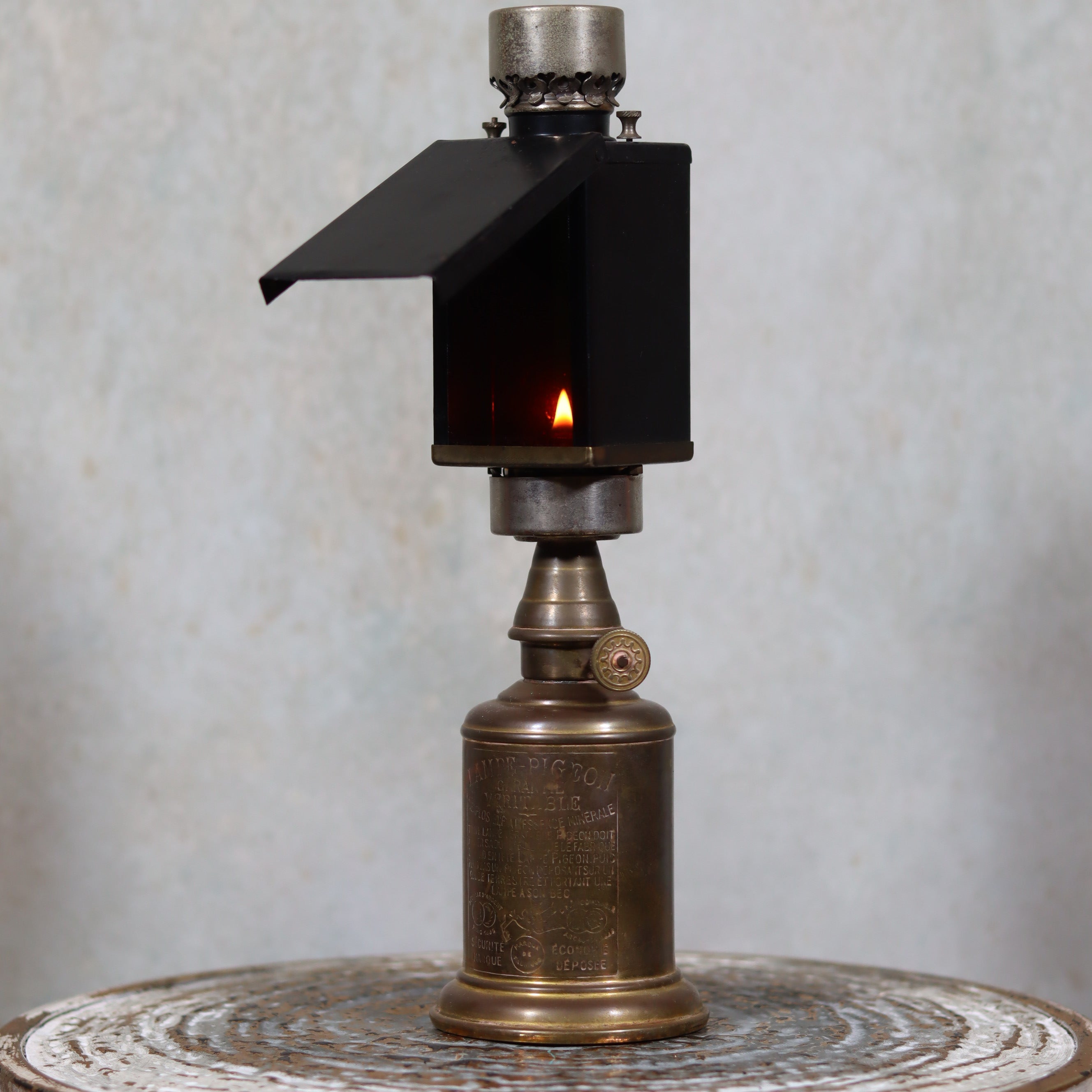Rare Darkroom Oil Lamp – Pigeon Lamp with “Lampe Junius” Attachment – Excellent Condition showing lit flame and brass base details