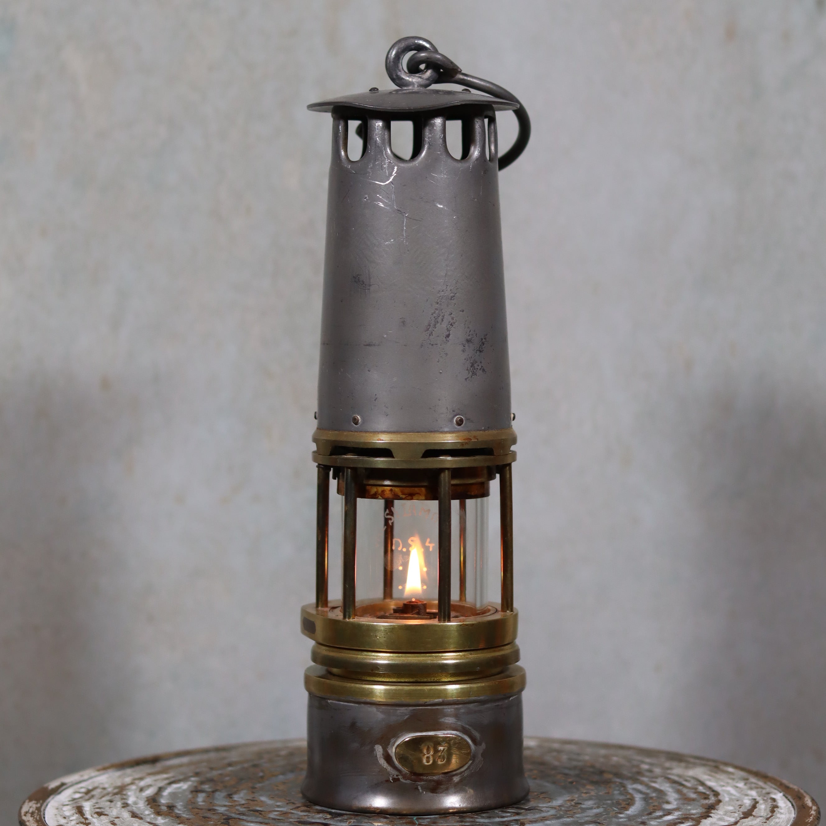 Beautiful, Almost Unused Miner’s Lamp by Hubert Joris (ca. 1900) with Val St. Lambert Glass showing lit oil lamp details and brass accents