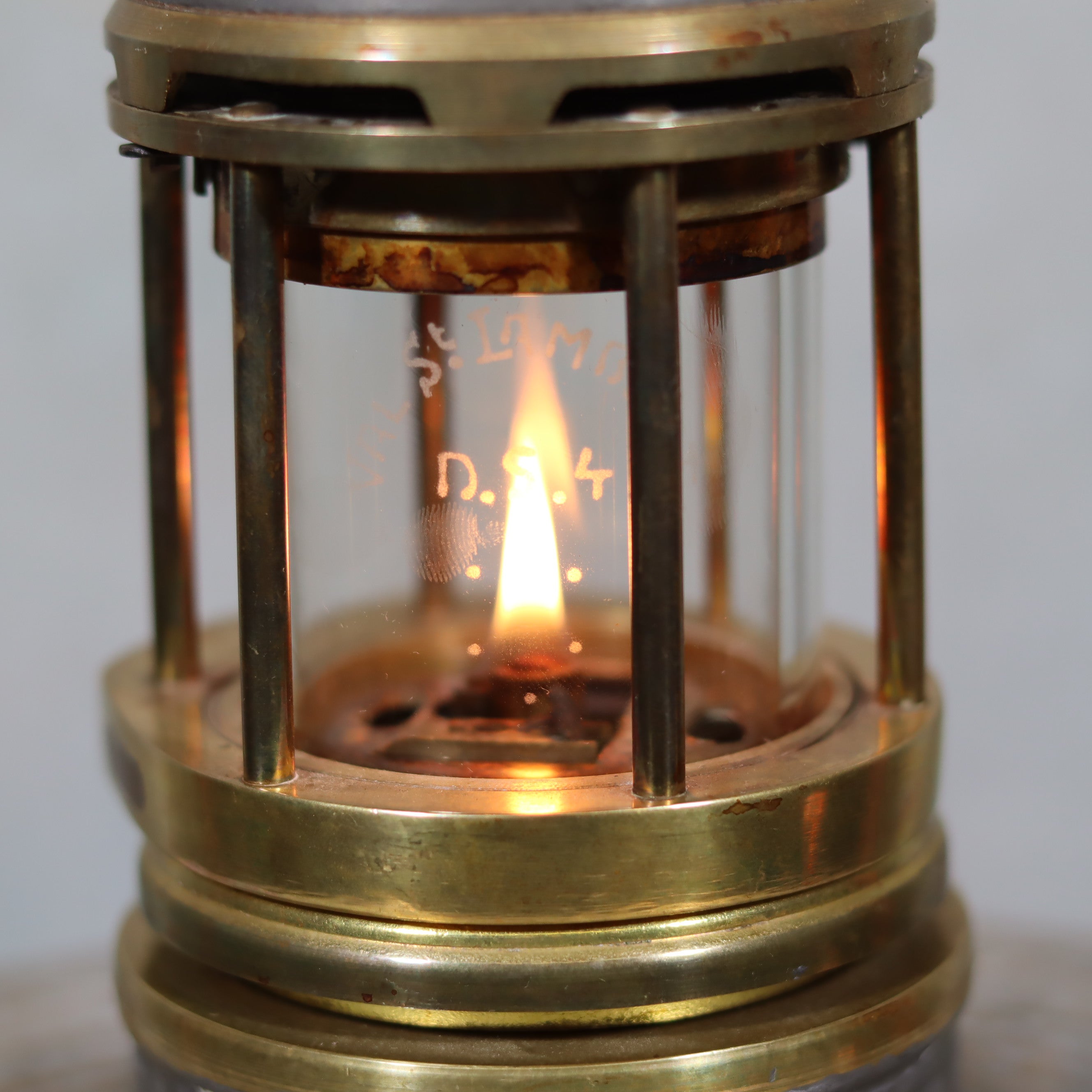 Beautiful, Almost Unused Miner’s Lamp by Hubert Joris (ca. 1900) with Val St. Lambert Glass showing lit oil lamp with brass casing.