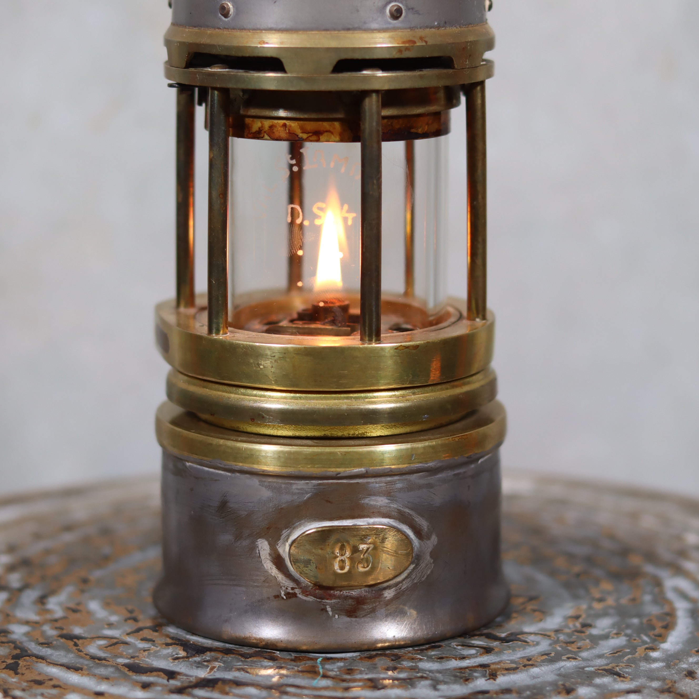 Beautiful, Almost Unused Miner’s Lamp by Hubert Joris (ca. 1900) with Val St. Lambert Glass showing detailed metal and lit oil lamp flame.