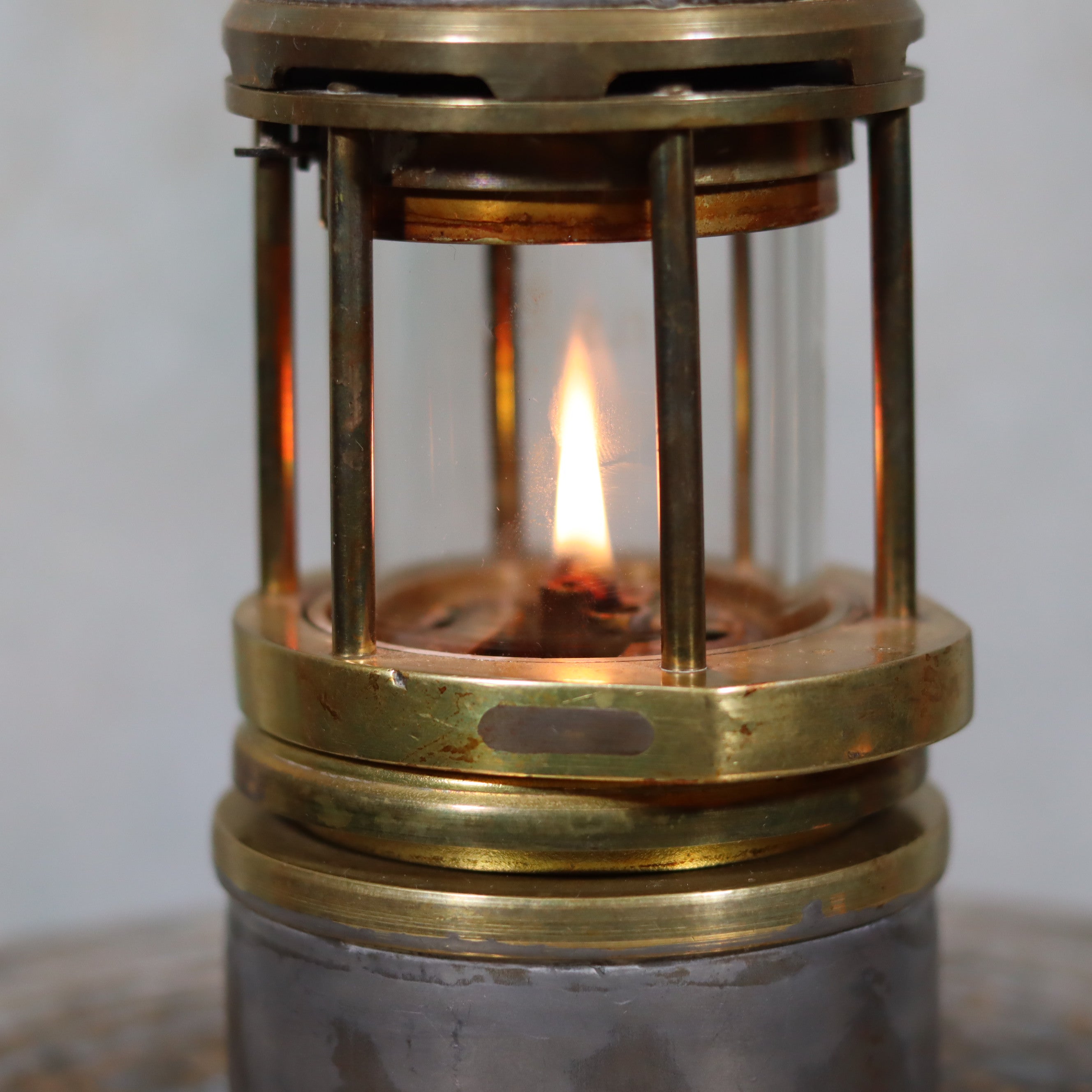Beautiful, Almost Unused Miner’s Lamp by Hubert Joris (ca. 1900) with Val St. Lambert Glass showing lit oil lamp flame and brass details