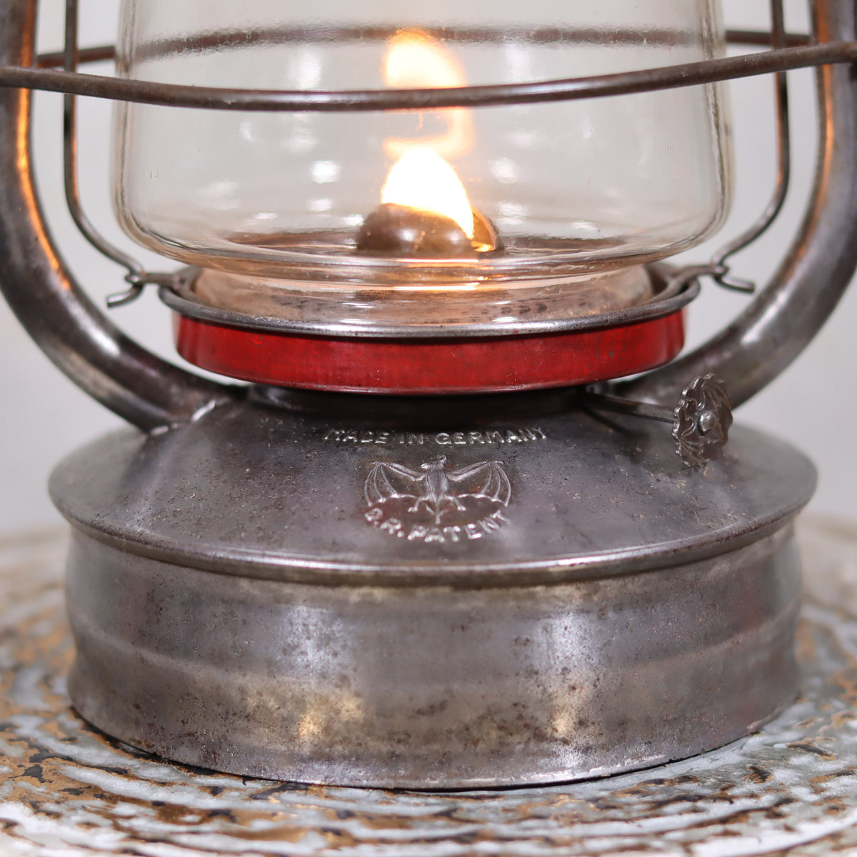 Exceptional Stübgen & Co. BAT 2850 Hurricane Lantern – Germany, ca. 1939–1940 – With Marked Glass and Red Accents oil lamp close-up light flame