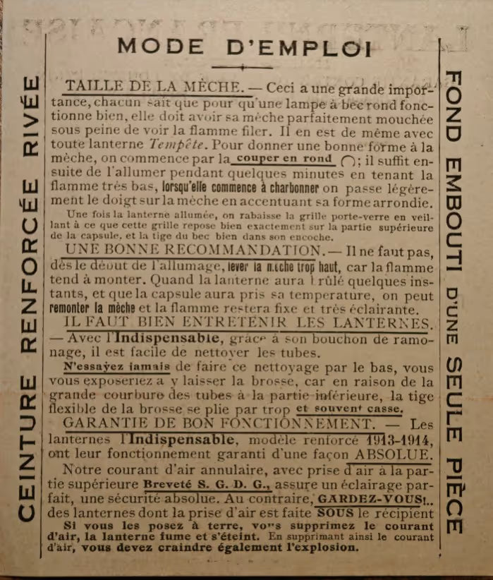 Close-up of oil lamp instructions showing detailed text on wick size and lamp maintenance in French with brand reinforcement visible.