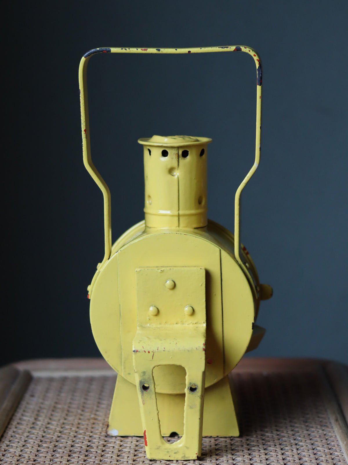 Vintage Dutch Railway Signal Lamp – NS Oil Lantern, 1930s showing vintage yellow railway oil lamp design and metal handle.