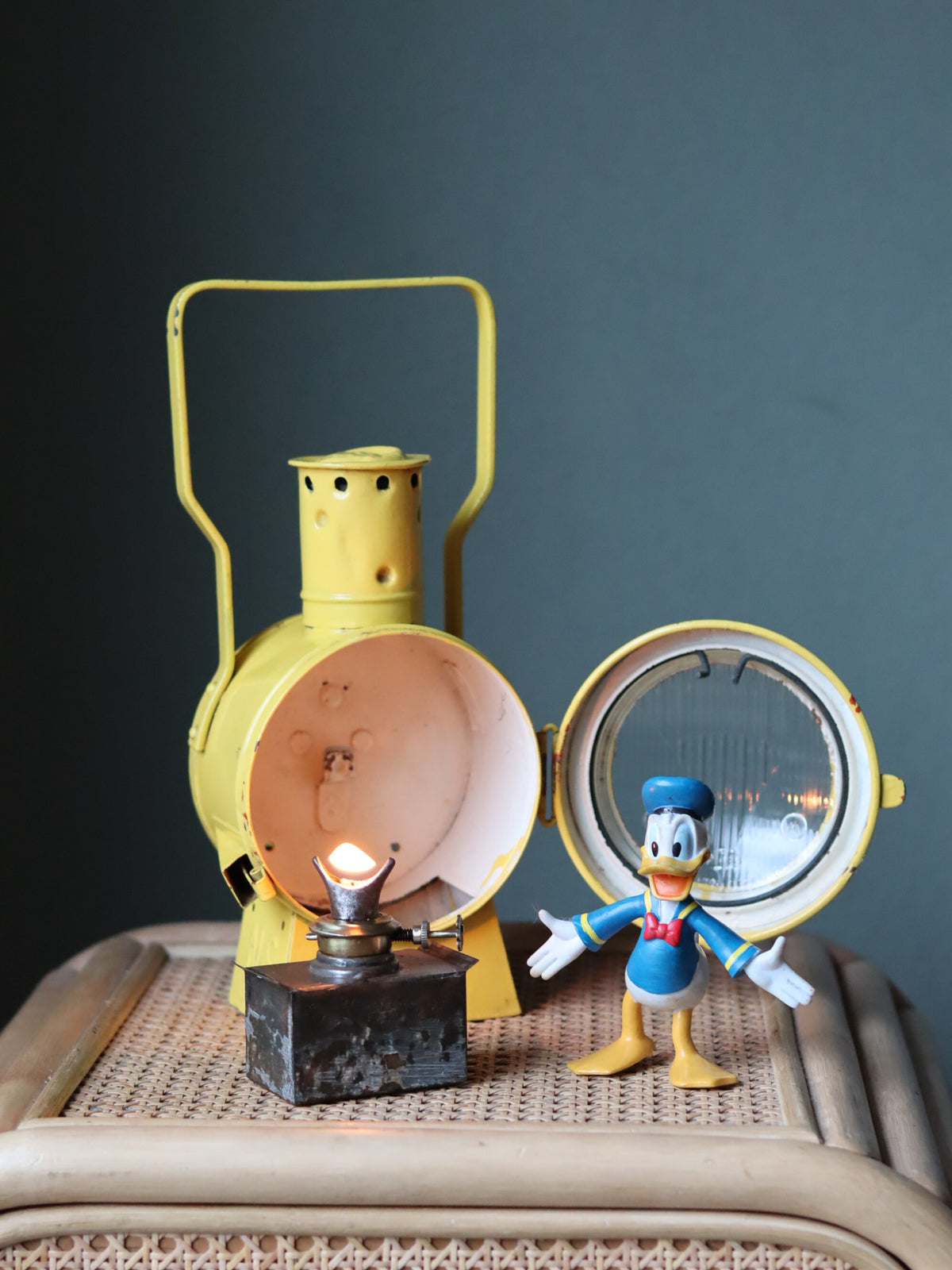Vintage Dutch Railway Signal Lamp – NS Oil Lantern, 1930s, classic yellow train oil lamp with open front and metal handle detail.