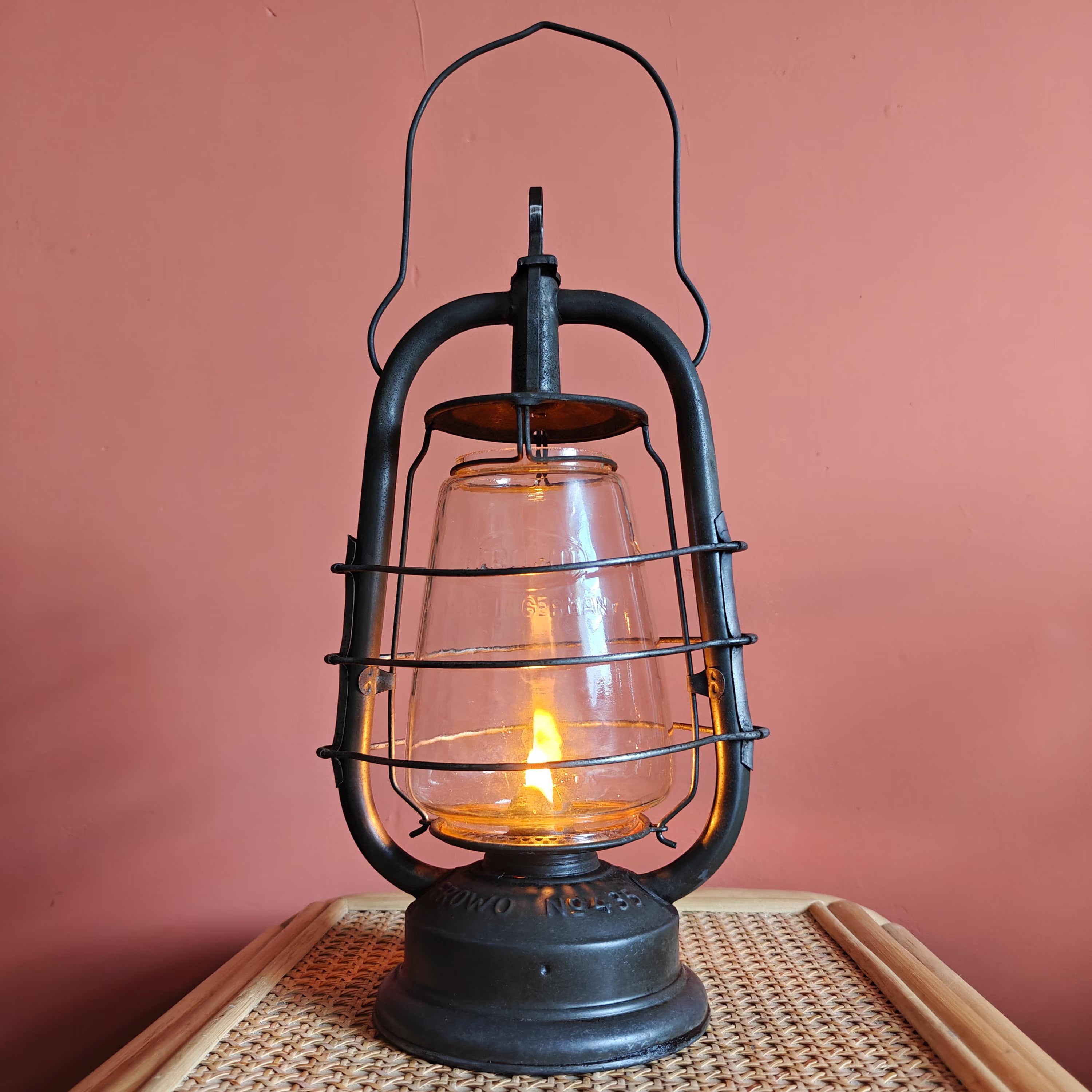 Vintage Frowo 435 Hurricane Lantern – 1960s Original with Marked Glass oil lamp showing lit flame and black metal frame