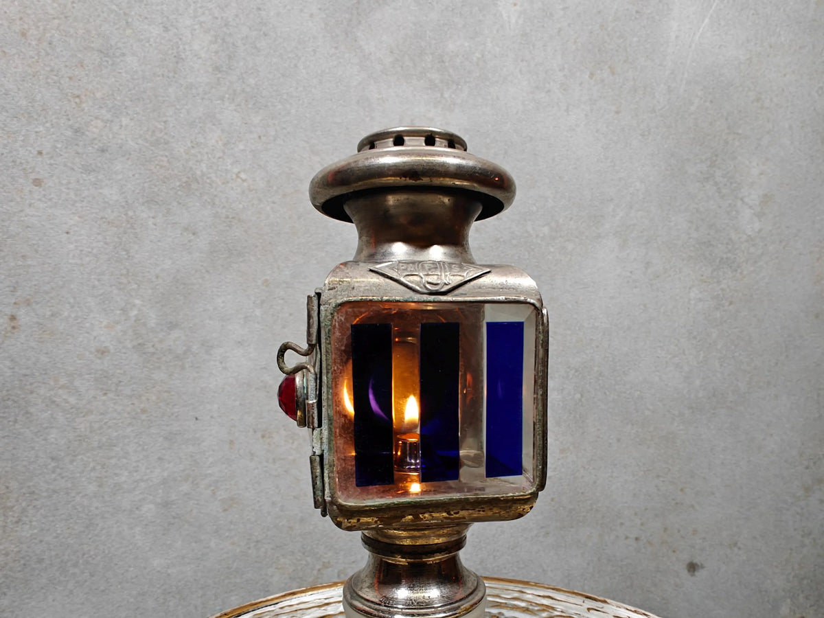 Extremely Rare Vintage Automobile Oil Lamp – Coll. J. Girard, Paris (1920s–1930s) lit antique French car lamp close-up.