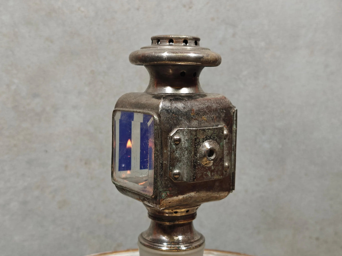 Extremely Rare Vintage Automobile Oil Lamp – Coll. J. Girard, Paris (1920s–1930s) showing detailed metal and lit flame.