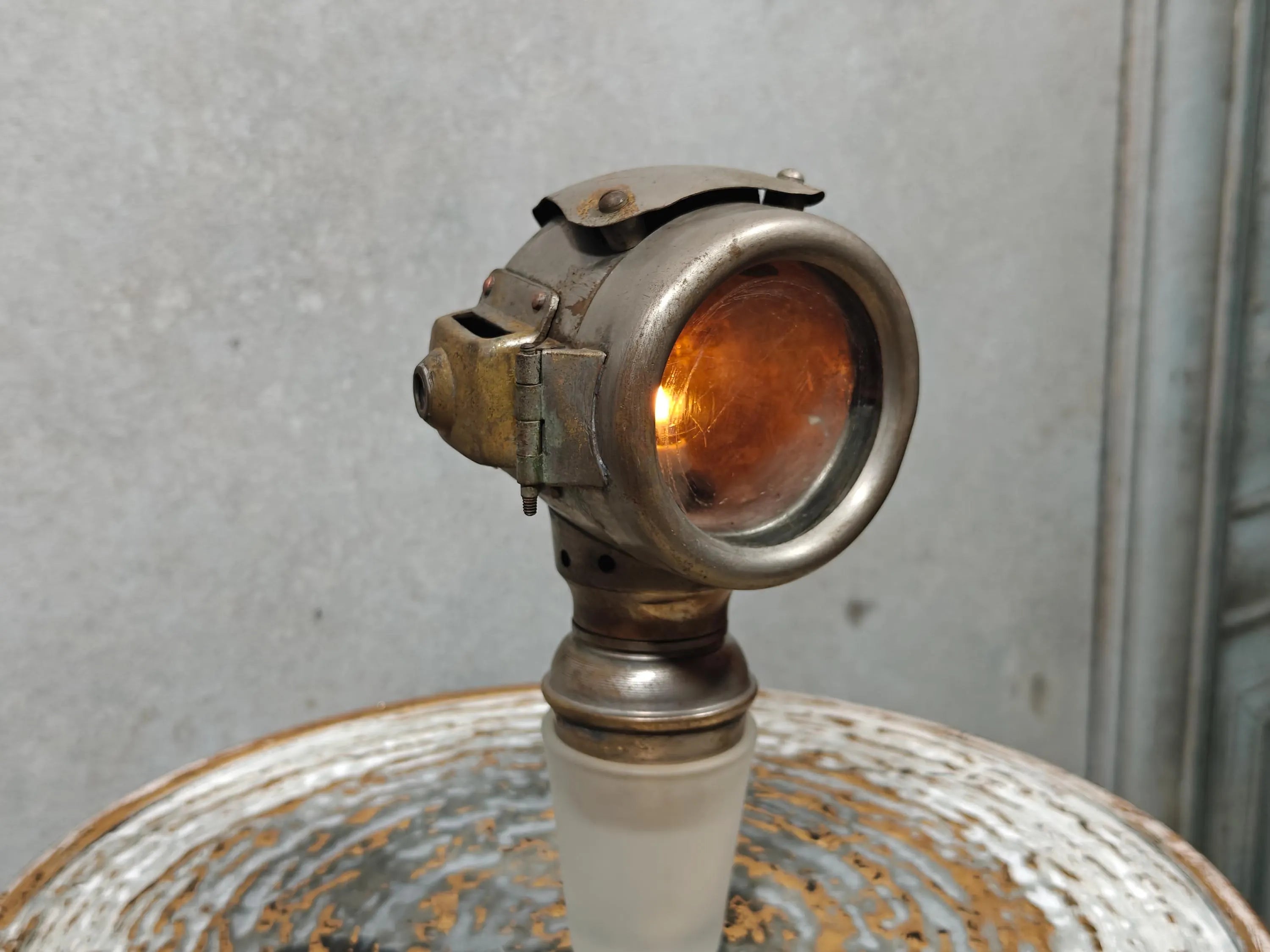Rare Vintage Automobile Oil Lamp – French Side Lamp (1920s/30s) showing aged metal with amber glass lens detail.