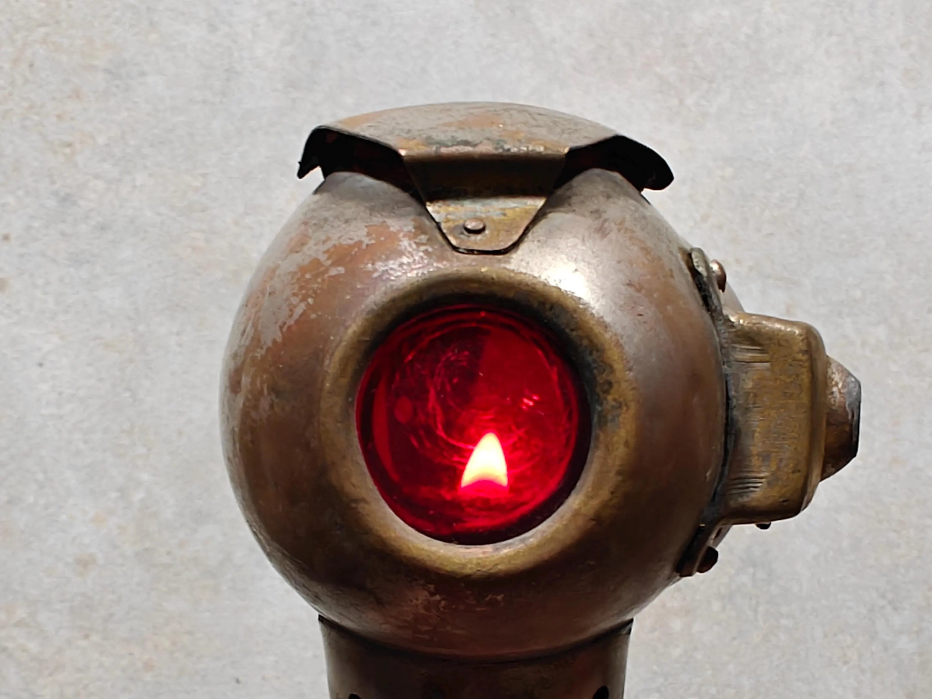 Rare Vintage Automobile Oil Lamp – French Side Lamp (1920s/30s) with lit red glass lens showcasing antique automotive design