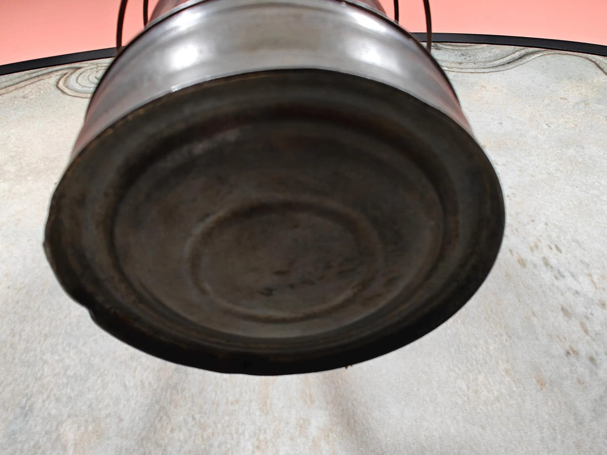 Bottom view of Vintage English Hurricane Lantern – Brass Tank Cap, 1930s Design oil lamp showing aged metal surface