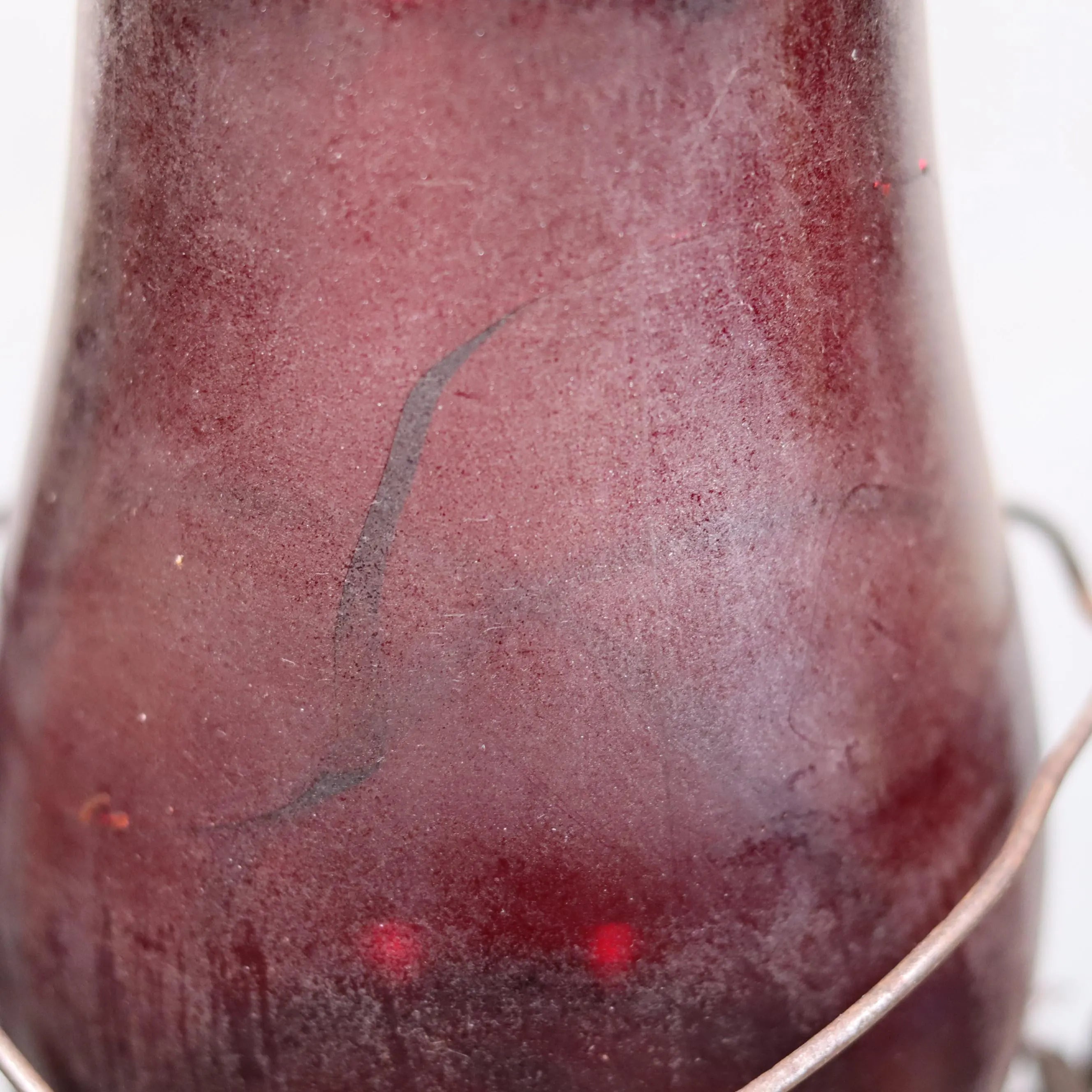 Rare Canadian Beacon Hurricane Lantern – Vintage Red Glass Kerosene Lamp with aged red glass and metal handle detail close-up.