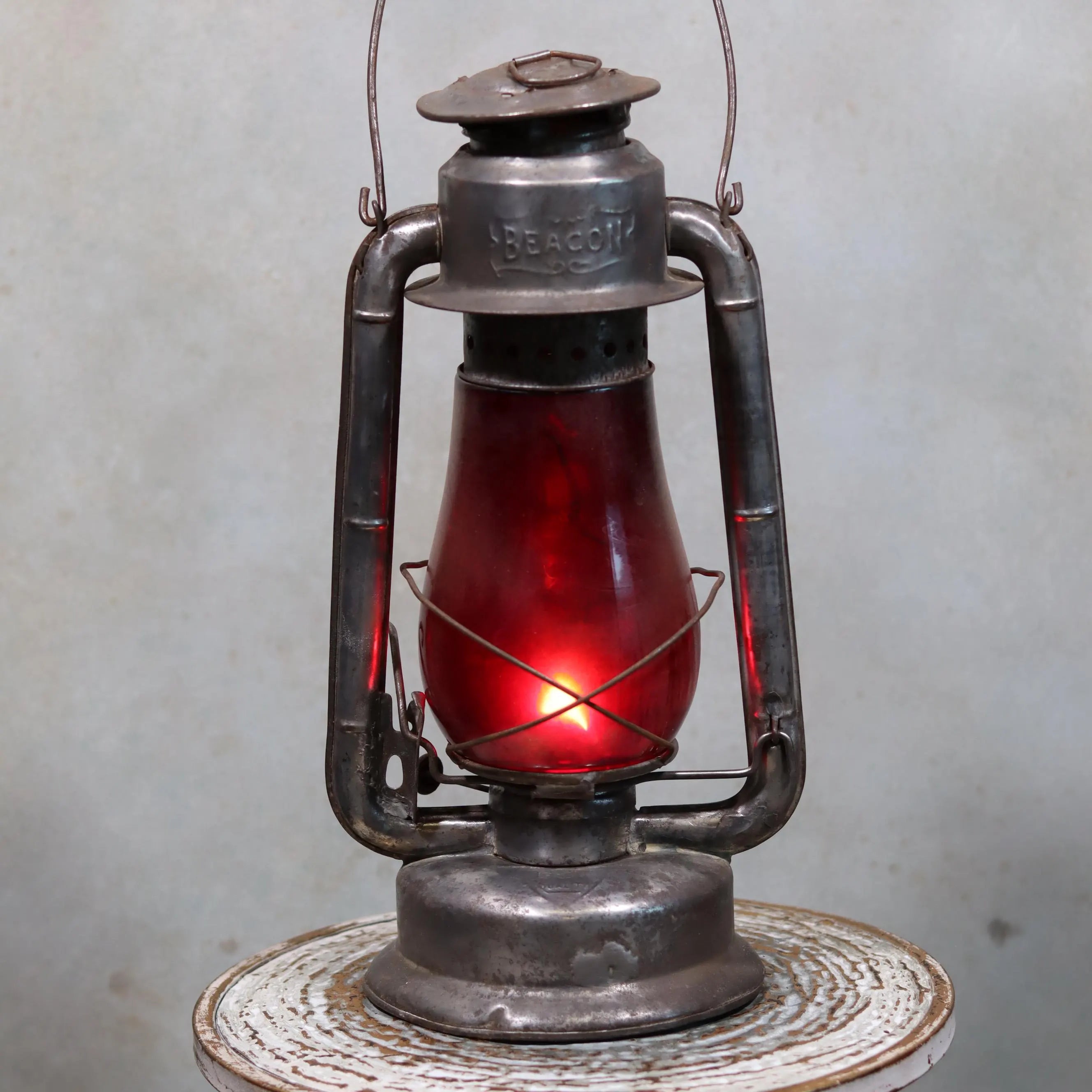 Rare Canadian Beacon Hurricane Lantern – Vintage Red Glass Kerosene Lamp with glowing red glass globe and metal frame