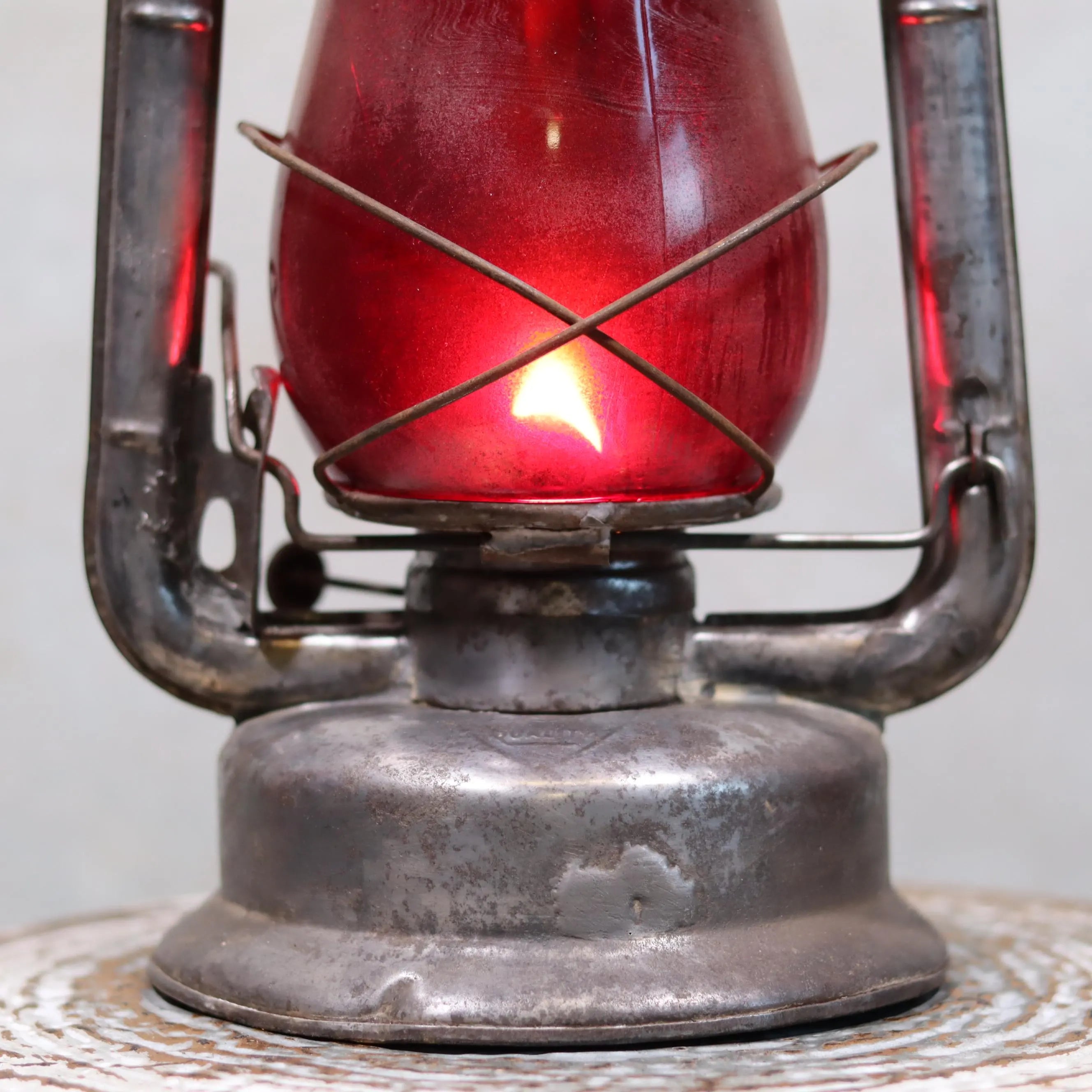 Rare Canadian Beacon Hurricane Lantern – Vintage Red Glass Kerosene Lamp with glowing red oil lamp and aged metal frame