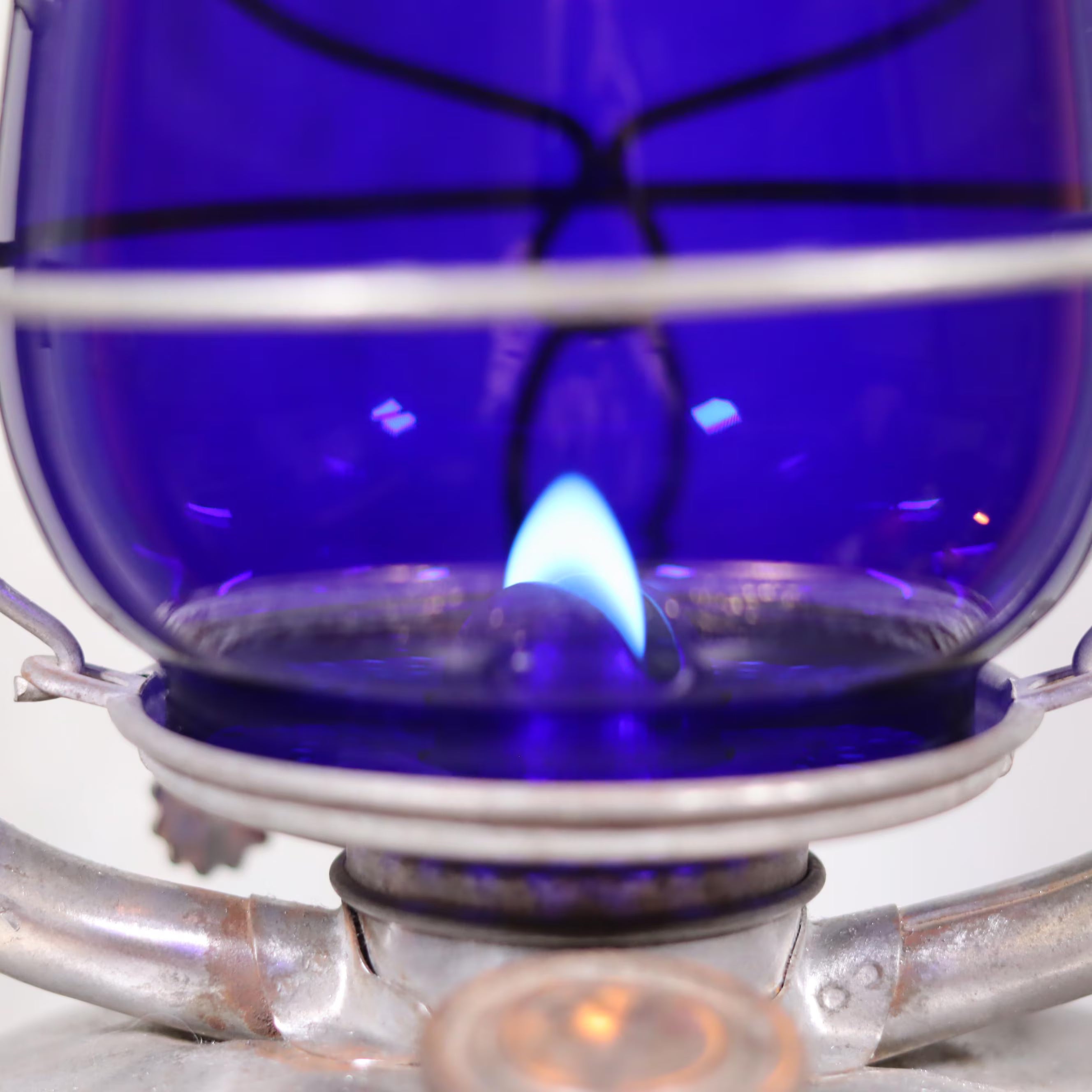 Rare Vintage ALG No. 2 French Storm Lantern – 1960s/70s – Blue Glass & Unique Handle showing lit oil lamp flame close-up